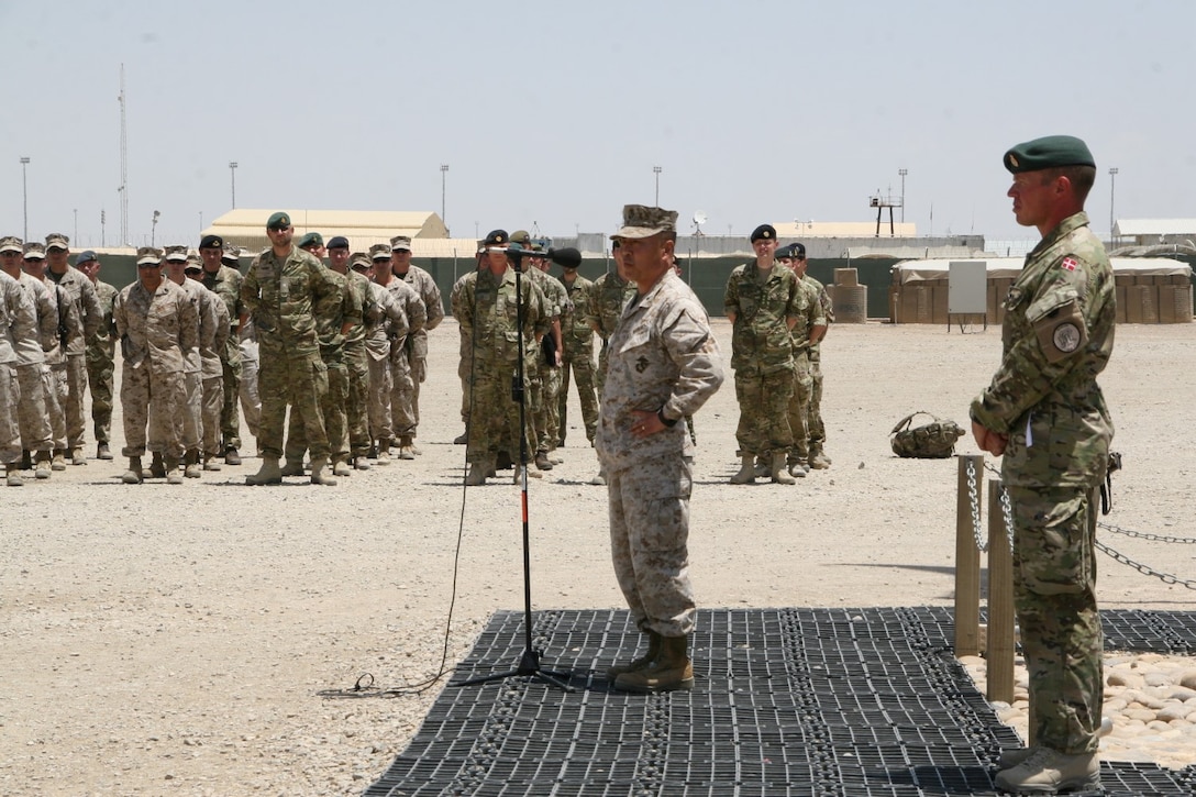 Brigadier Gen. Daniel D. Yoo, center, commander, Regional Command (Southwest), addresses the service members during the Danish Contingent end of mission ceremony aboard Camp Bastion, Afghanistan, May 20, 2014. This year marked the 17th rotation and final deployment to Afghanistan for DANCON. Since their first mission began, more than 18,000 Danish soldiers have deployed to the country.