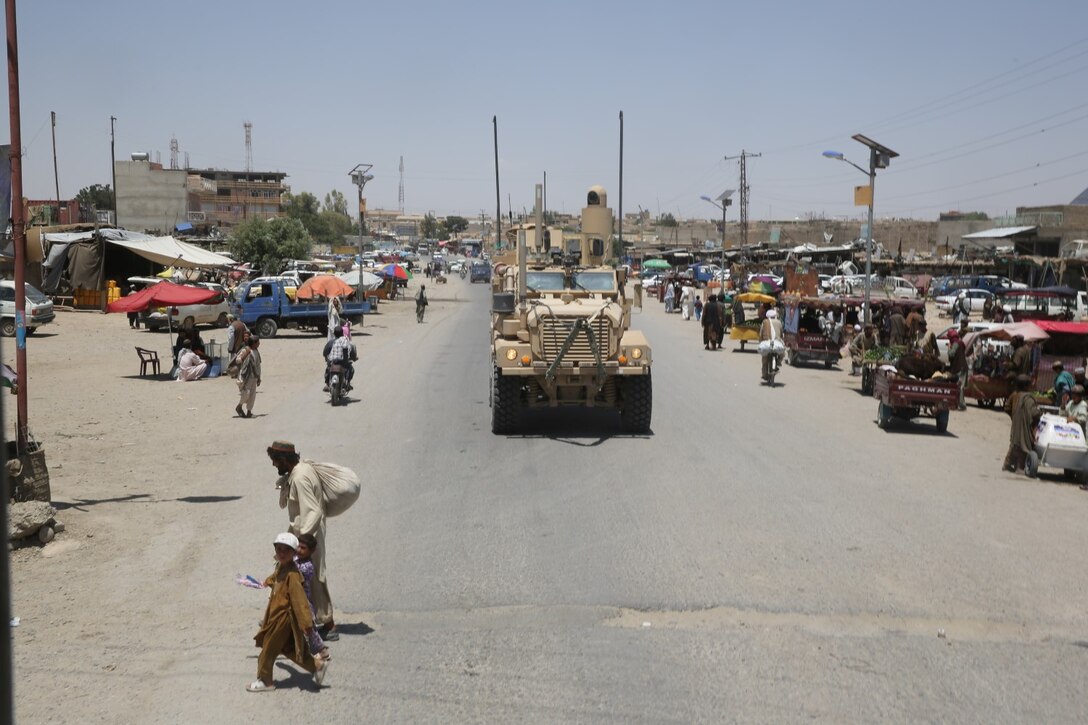 Marines with Weapons Company, 1st Battalion, 7th Marine Regiment, patrol through a bazaar in Gereshk, Afghanistan, during a mission in Helmand province, May 12, 2014. The company disrupted Taliban fighters to aid in the retrograde of Sturga II, a British base northeast of Lashkar Gah. The battalion has conducted dozens of missions since they assumed their battlespace March 15, but this was their first combat engagement with insurgents since their arrival in country.