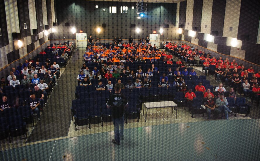 Col. Kenneth Ekman, 8th Fighter Wing commander, addresses three base squadrons during the 2014 Sexual Assault Prevention and Response down day at Kunsan Air Base, Republic of Korea, May 22, 2014. The Wolf Pack halted operations for the day and Airmen attended an all-call, participated in a ‘silent walk’ and had group discussions to address and discuss sexual assault in the military. (U.S. Air Force photo by Senior Airman Armando A. Schwier-Morales/Released)