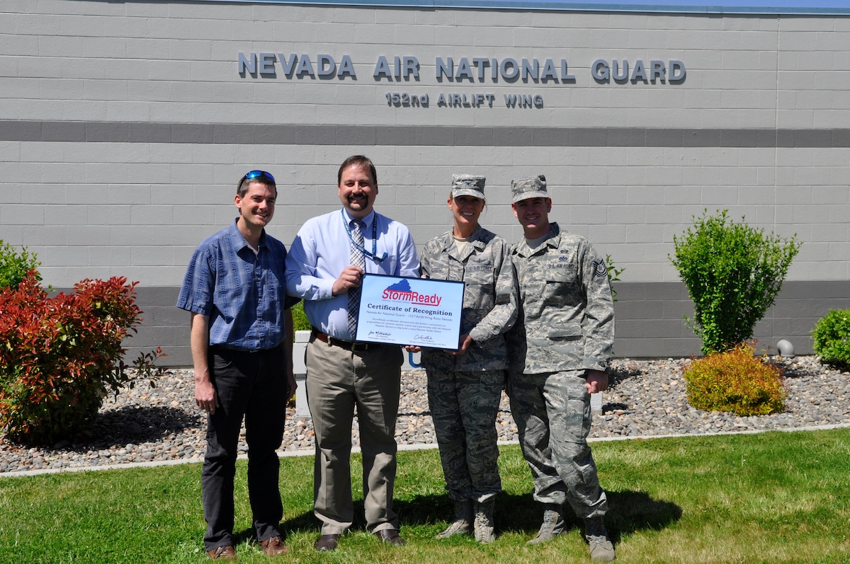152nd Maintenance Group Commander, Col. Barbara Morrow, and 152nd Airlift Wing Emergency Manager, Tech. Sgt. Tim Hill, accepted, on behalf of the 152nd Airlift Wing, the National Oceanic and Atmospheric Administration’s “StormReady” certificate from Mr. Chris Smallcomb (left) and Mr. Jon Mittelstadt (right). (USAF Photo by Master Sgt. Paula Macomber, 152nd Airlift Wing Public Affairs. RELEASED.)