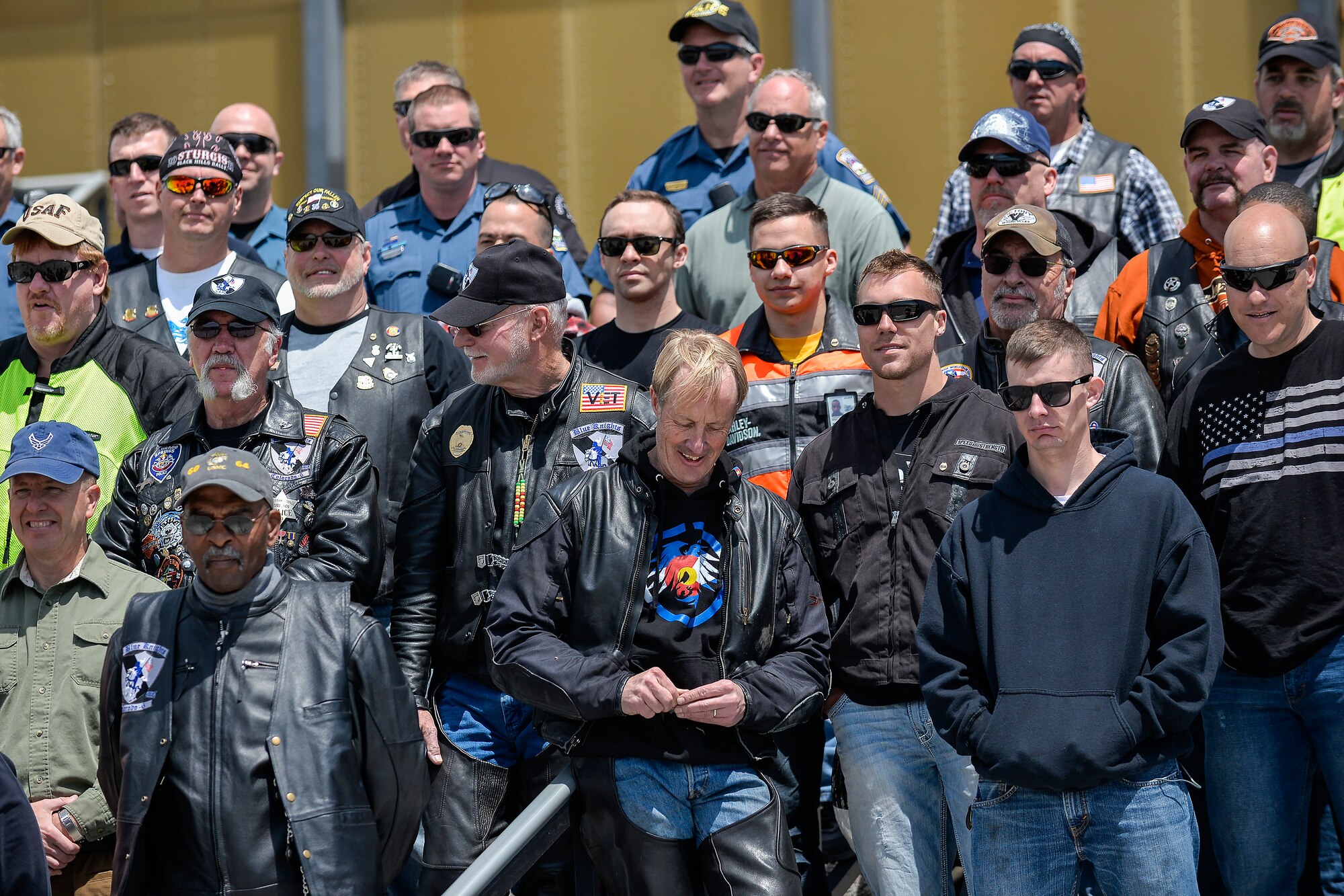 Dozens of military and civilian law enforcement officials pose for a photo March 22 during the 2014 National Police Week Motorcycle Run, designed as a tribute to law enforcement officers killed in the line of duty. The ride took the from Cheyenne Mountain Air Force Station, Fort Carson, Peterson Air Force Base, Schriever AFB and the Academy. During their short time at the Academy, the group stopped at the Cadet Chapel for a moment of silence. (Liz Copan/U.S. Air Force photo) 