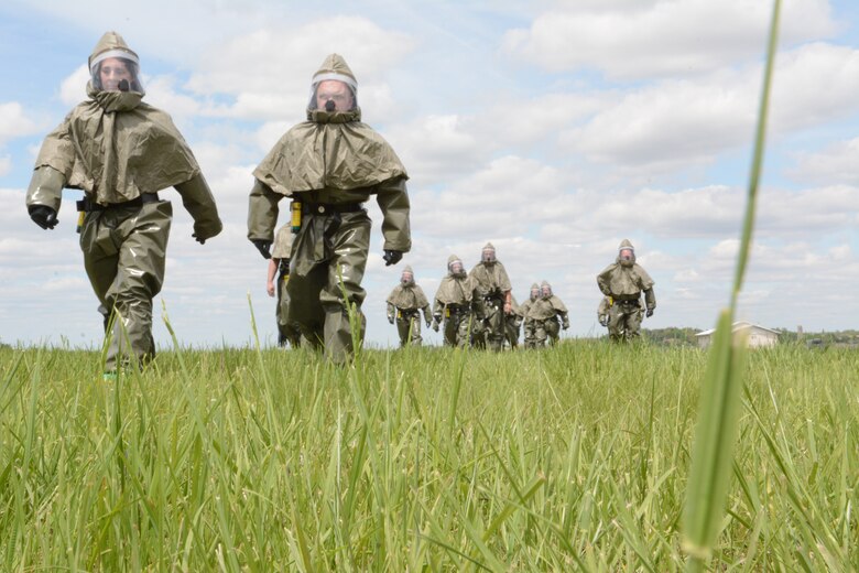 Airmen test their chemical suits during a 976A Patient Decontamination certification at the 115th Fighter Wing in Madison, Wis., May 22, 2014. The 976A team is made up of people from different areas of the base, so that base personnel affected by a chemical situation don’t have to wait for the firefighters and security forces units to be available. If an actual emergency occurred, the firefighters and security forces Airmen would be required elsewhere. (Air National Guard photo by Senior Airman Andrea F. Liechti)