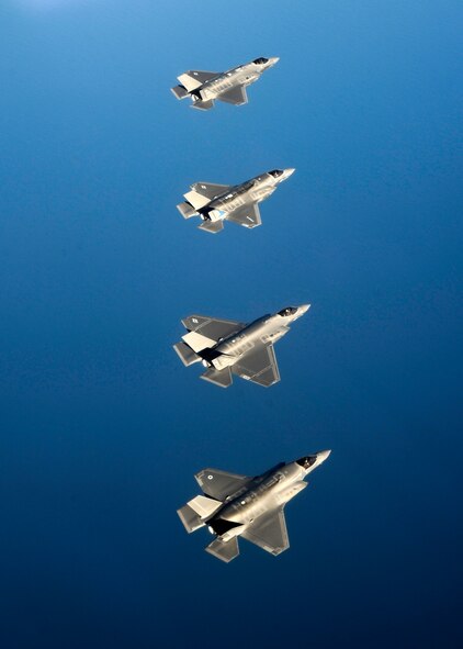 A United Kingdom F-35B Lightning II flies alongside a Navy F-35C, a Marine Corps F-35B, and an Air Force F-35A from the 33rd Fighter Wing in the skies above Eglin Air Force Base, Fla. May 21. The F-35s at Eglin AFB surpassed 5,000 combined training sorties May 28, contributing more than a third of all sorties in the Department of Defense program. The 33rd FW F-35 Integrated Training Center trains F-35 A/B/C Lightning II pilots, maintainers, air battle managers and intelligence personnel for the Marine Corps, the Navy, the Air Force and, in the future, at least eight international partners. (U.S. Air Force photo/Staff Sgt. Katerina Slivinske)