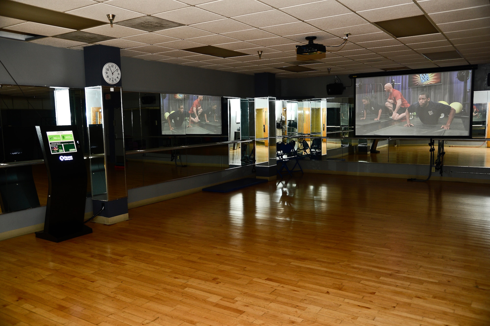 The aerobics room is one of two locations, the spin room is the other, where customers can utilize the Fitness on Request kiosks in the Short Fitness Center at MacDill Air Force Base, Fla. Videos feature a virtual instructor and assistants who perform the exercise routines at different skill levels. (U.S. Air Force photo by Airman 1st Class Vernon L. Fowler Jr./Released)