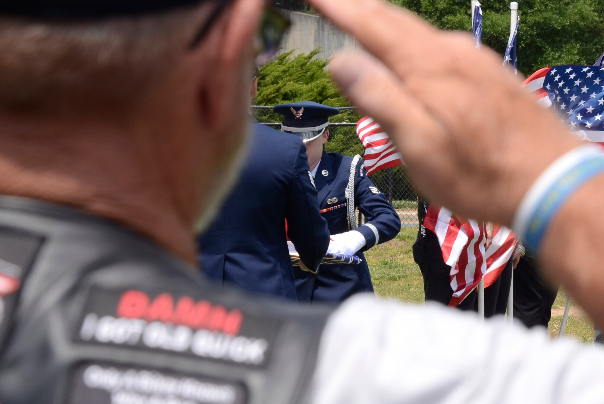 Staff Sgt. Joshua Koon and Senior Airman Kellie Creel, from the 94th Airlift Wing Honor Guard, Dobbins Air Reserve Base, Ga., perform a flag folding ceremony during a Military Appreciation Group luncheon sponsored by The Home Depot Corporate Headquarters, Atlanta, Ga. May 23, 2014. The program included Flag-Line demonstration by Patriot Guard Riders Association, Missing Man Table, and Fallen Heroes Bell Ceremonies. (U.S. Air Force photo/Don Peek)