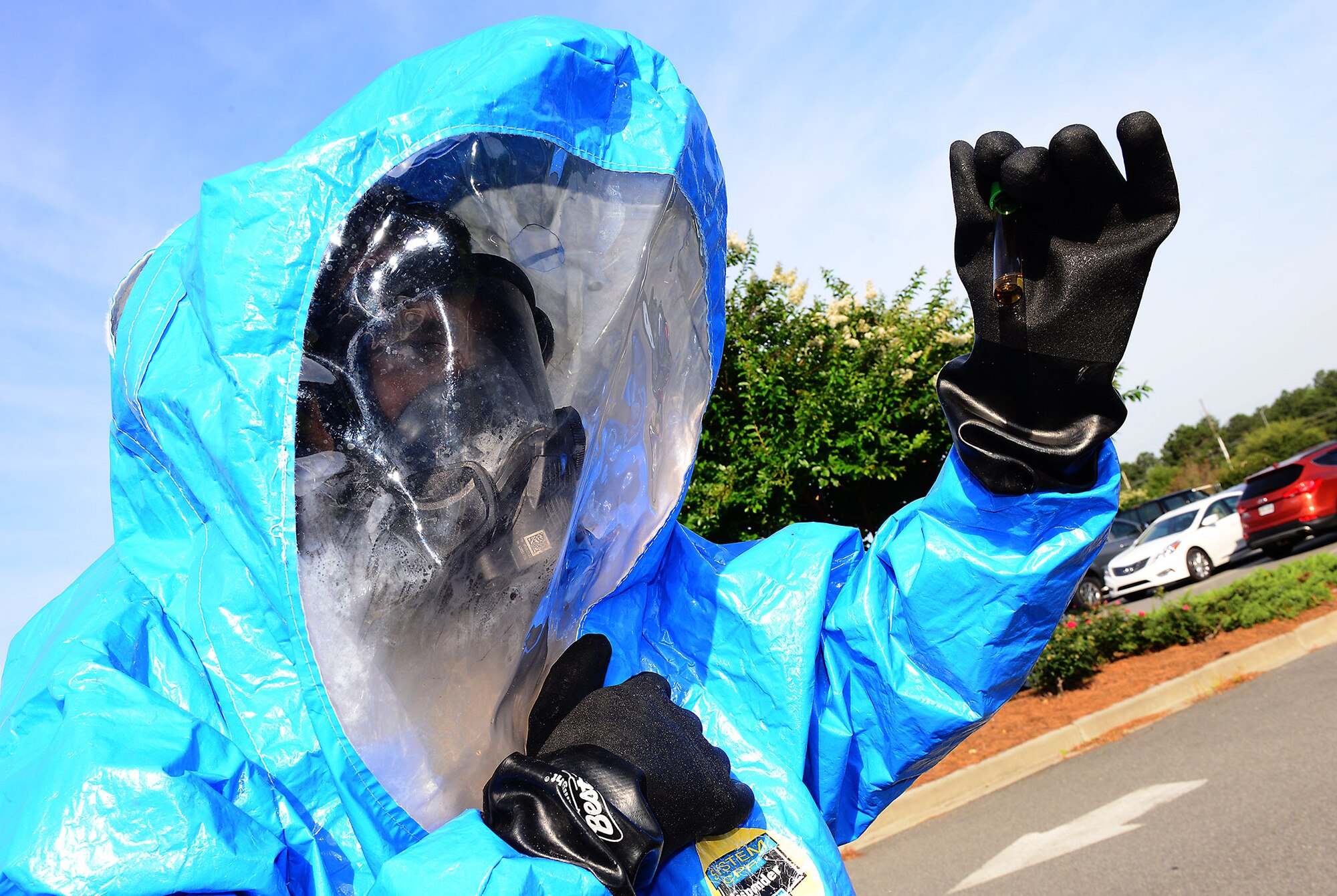 U.S. Air Force Senior Airman Christopher Cameron, 23d Aerospace Medicine Squadron bioenvironmental engineering technician, analyzes a chemical sample wearing a training Level A suit, at Moody Air Force Base, Ga., May 29, 2014. The Level A suit is used to respond to chemical, biological, radiological, nuclear and physical threats. (U.S. Air Force photo by Senior Airman Tiffany M. Grigg/Released) 