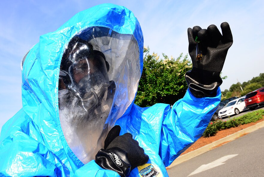 U.S. Air Force Senior Airman Christopher Cameron, 23d Aerospace Medicine Squadron bioenvironmental engineering technician, analyzes a chemical sample wearing a training Level A suit, at Moody Air Force Base, Ga., May 29, 2014. The Level A suit is used to respond to chemical, biological, radiological, nuclear and physical threats. (U.S. Air Force photo by Senior Airman Tiffany M. Grigg/Released) 