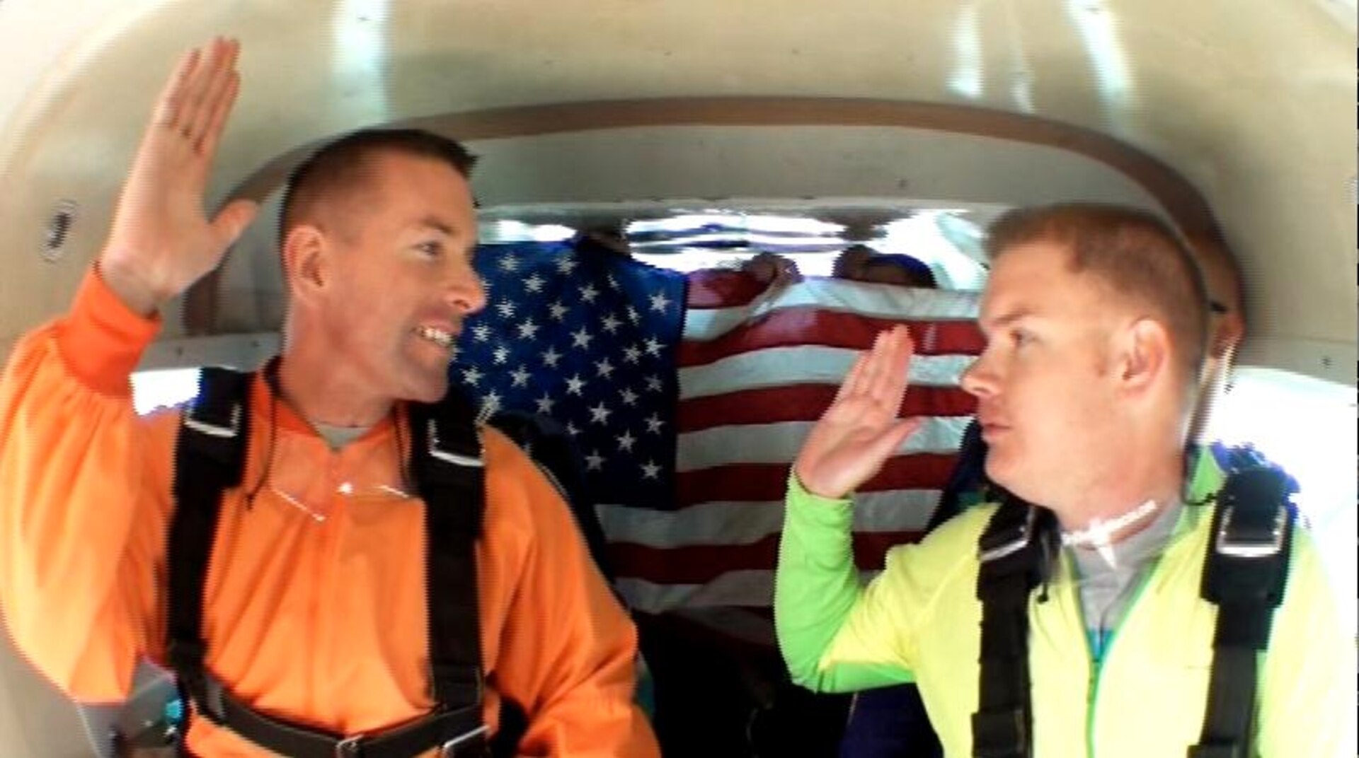 Maj. Gregory Bodenstein (left), 902nd Security Forces Squadron commander, leads the re-enlistment of Tech. Sgt. Taylor Rogal, 902nd SFS training NCO in charge, May 15 prior to skydiving from 10,000 ft. in San Marcos, Texas. (Courtesy Photo)