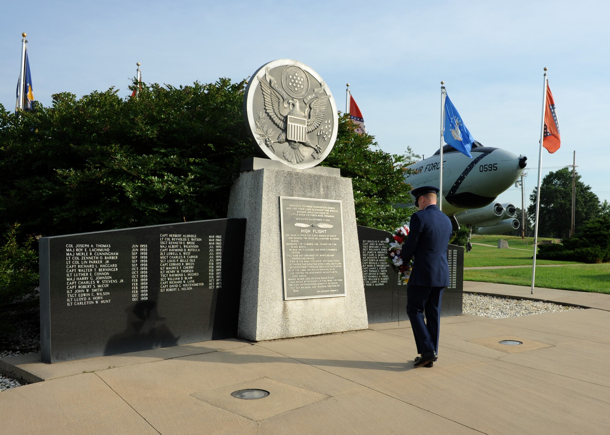 Col. Patrick Rhatigan, 19th Airlift Wing commander, carries a wreath during a wreath-laying ceremony May 26, 2014, at Little Rock Air Force Base, Ark. Team Little Rock Leadership honored the fallen by laying wreaths in three different memorials within Heritage Park. (U.S. photo by Airman 1st Class Scott Poe) 