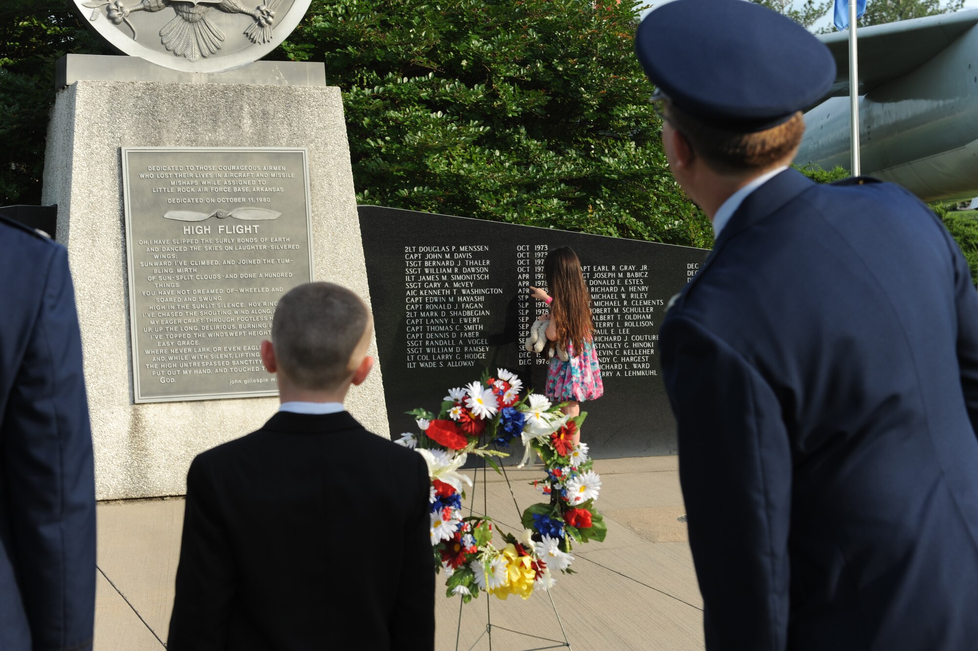 Team Little Rock members read names from the Little Rock Air Force Base memorial May 26, 2014, at Little Rock AFB, Ark. Team Little Rock members, families and friends were invited to attend the Memorial Day ceremony held at Heritage Park. (U.S. photo by Airman 1st Class Scott Poe)