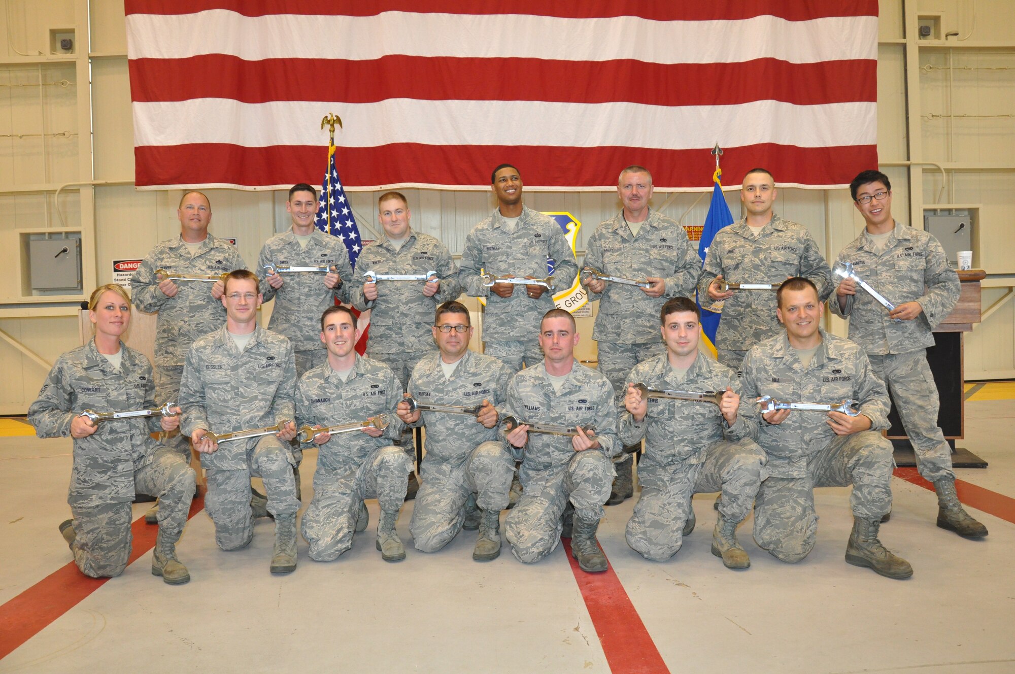 Silver Wrench winners display their awards. Front row: Sernior Airmen Lisa Cowart, Jason Gessler, Christopher Cavanaugh, Jacob Koslofsky, Kendall Williams, Giovanni Lewis,  and Timothy Hill. Back row: Senior Master Sgt. Robert Reaves, Senior Airman David Smith, Staff Sgt. Christopher White, Technical Sgts. Damion Howell, Larry Bailey and Robert Light; and Senior Airman Kyle Nagamatsu. (photo by Tech. Sgt. Jay Ponder)