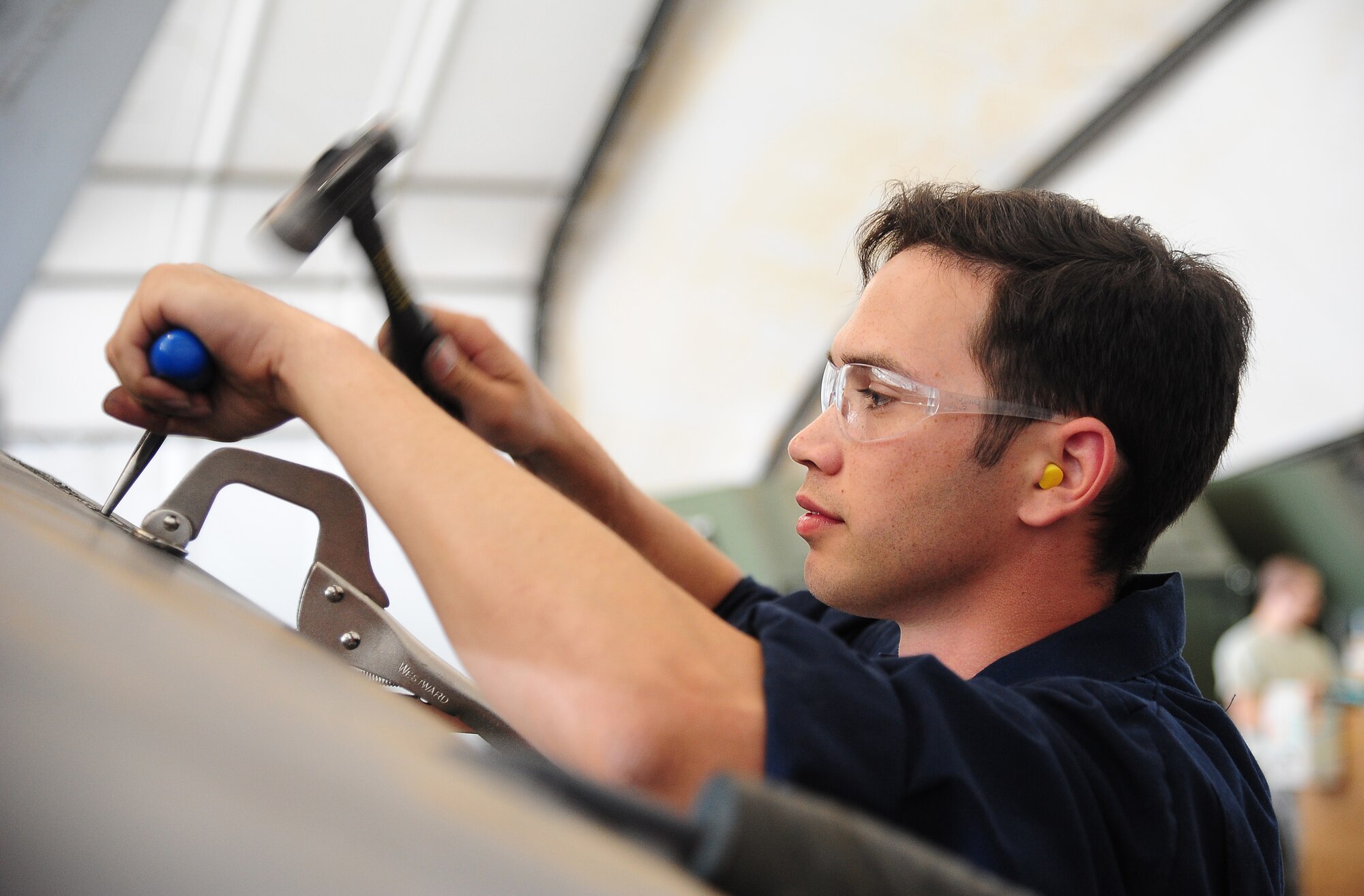 U.S. Air Force Senior Airman Charlton Long, a sheet metal journeyman with the 13th Aircraft Maintenance Unit at Misawa Air Base, Japan, performs phase maintenance during Exercise Eager Lion May 27, 2014, at an air base in northern Jordan. Airpower played a vital role in the exercise, which also features air, land and sea forces from the U.S. Marine Corps and U.S. Navy. This year, more than 12,500 personnel from more than 20 nations are participating in the exercise, which is designed to strengthen military-to-military relationships and interoperability. (U.S. Air Force photo by Staff Sgt. Brigitte N. Brantley/Released)