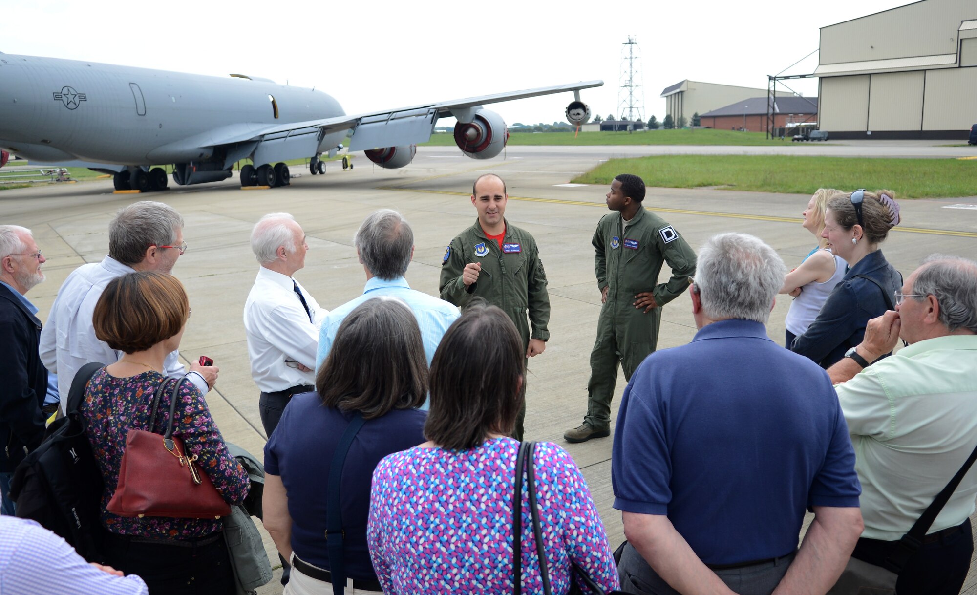 U.S. Air Force Capt. Phillip Glorioso, center, 351st Air Refueling Squadron pilot from Pittsburgh, explains how the KC-135 Stratotanker fits into the Team Mildenhall mission to members of the Mildenhall Register May 16, 2014, during a base tour on RAF Mildenhall, England. The Mildenhall Register toured the base with former members of the Royal Air Force who were stationed here during World War II. (U.S. Air Force photo by Airman 1st Class Dillon Johnston/Released)