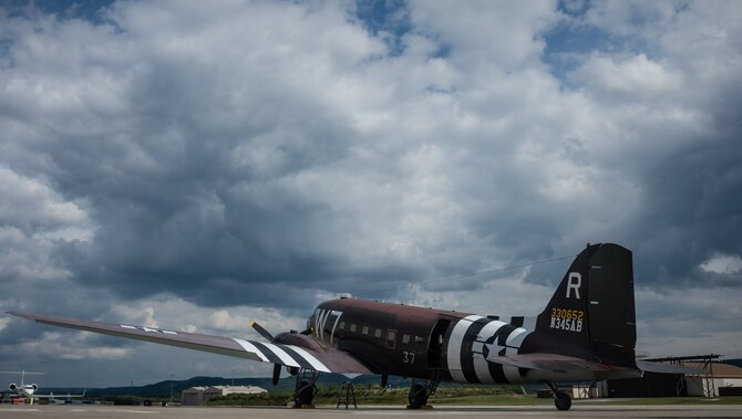 A Douglas C-47 Skytrain, designated Whiskey 7, sits on the flight line in preparation for events commemorating the 70th anniversary of D-Day in Normandy, on Ramstein Air Base, Germany, May 28, 2014. Whiskey 7 led the legacy squadron that would become the 37th AS, recently returned to mainland Europe and landed at Ramstein Air Base. Whiskey 7 was assigned to the 37th Troop Carrier Squadron as the lead aircraft for the unit and dropped the 3rd Battalion, 505th Parachute Infantry Regiment, 82nd Airborne Division on Drop Zone "O" near Sainte-Mere Eglise, France. (U.S. Air Force photo/Airman 1st Class Jordan Castelan)
