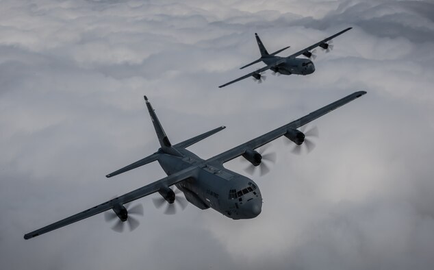 Two 37th Airlift Squadron C-130J Super Hercules aircraft practice flying in formation in preparation for events commemorating the 70th anniversary of D-Day in Normandy, over Germany, May 27, 2014. A Douglas C-47 Skytrain, known as Whiskey 7 led the legacy squadron that would become the 37th AS, recently returned to mainland Europe and landed at Ramstein Air Base. The C-47 was assigned to the 37th Troop Carrier Squadron as the lead aircraft for the unit and dropped the 3rd Battalion, 505th Parachute Infantry Regiment, 82nd Airborne Division on Drop Zone "O" near Sainte-Mere Eglise, France. (U.S. Air Force photo/Airman 1st Class Jordan Castelan)