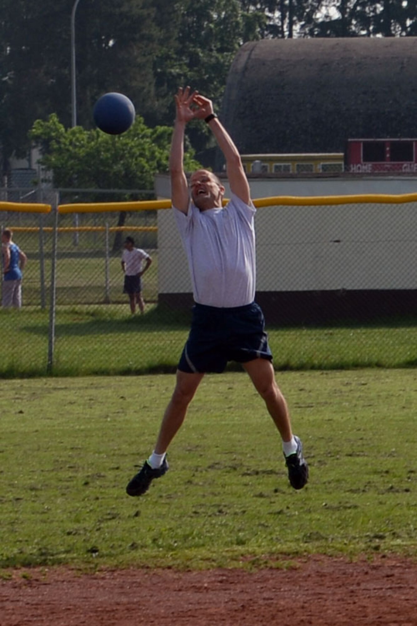 A member of the 52nd Fighter Wing Wing Staff Agency team attempts to catch a ball during a wing sports day kickball tournament at Spangdahlem Air Base, Germany, May 29, 2014. Kickball was one of five sports that base members had the option of competing in. (U.S. Air Force photo by Senior Airman Alexis Siekert/Released)