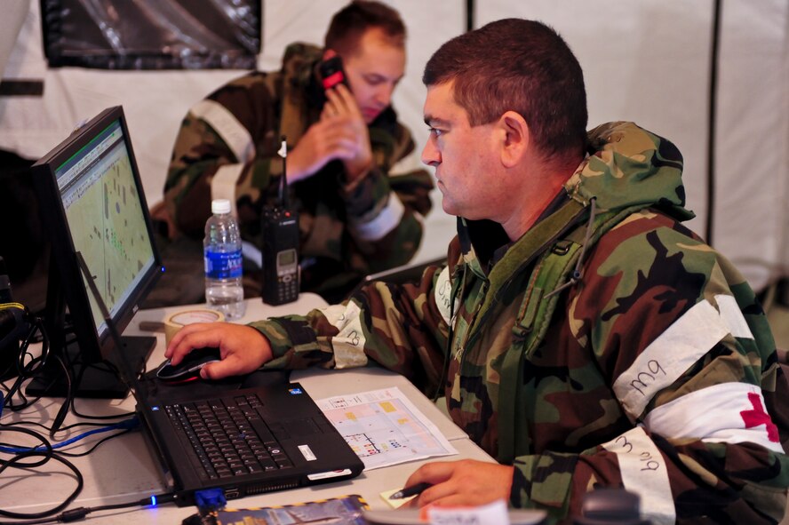 Staff Sgt. Christopher Preveziotis, 4th Medical Support Squadron NCO in charge of TRICARE operations and patient administration, operates the medical control center, May 21, 2014, during Employment Exercise CORONET WARRIOR 14-02 at Seymour Johnson Air Force Base, North Carolina.  The exercise assessed Airmen’s readiness and ability to complete missions in a deployed environment.  (U.S Air Force photo/Airman 1st Class Brittain Crolley)  