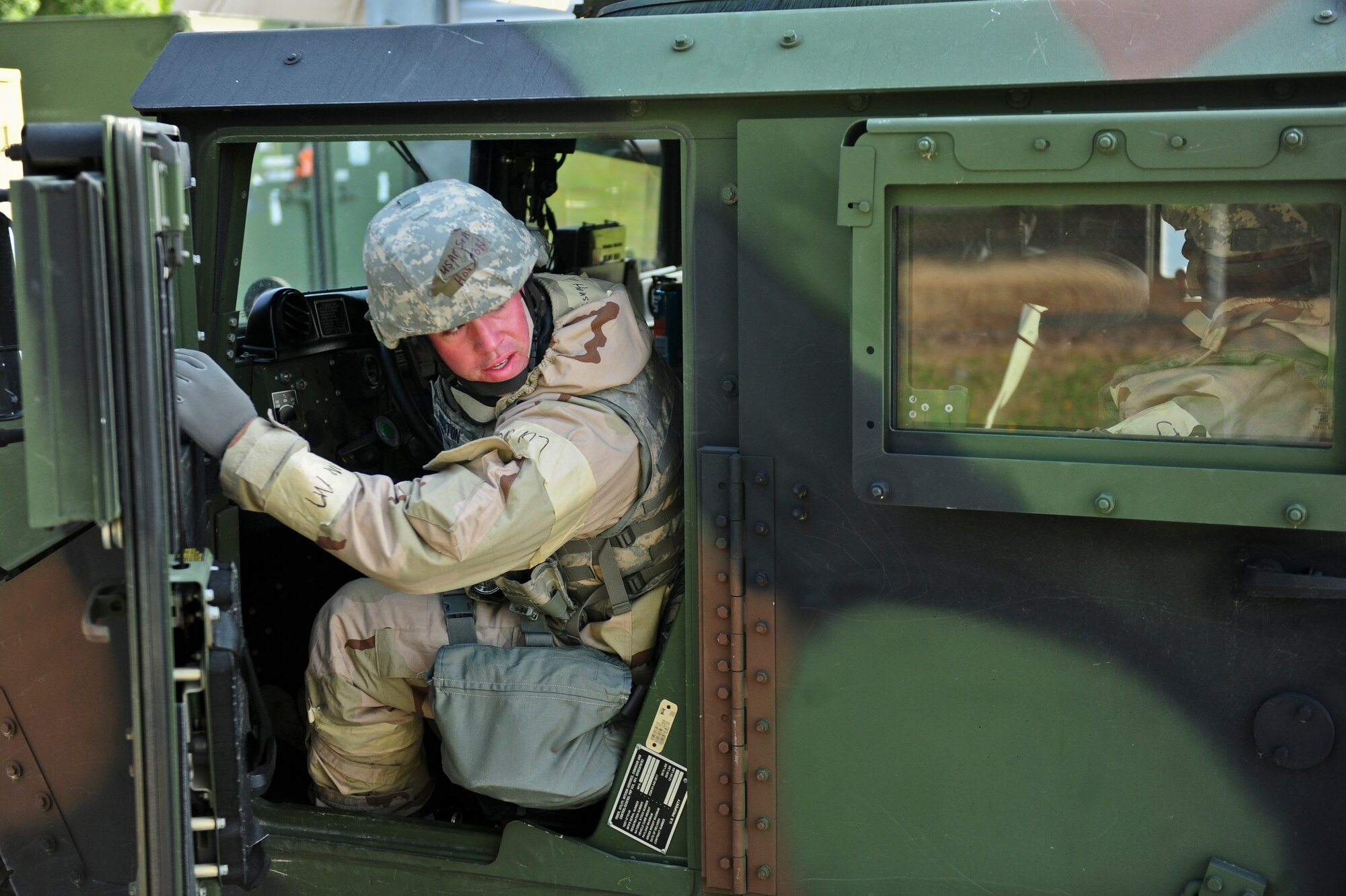 Senior Airman Joshua Houston, 4th Security Forces Squadron defender, backs up an armored vehicle, May 21, 2014, during Employment Exercise CORONET WARRIOR 14-02 at Seymour Johnson Air Force Base, North Carolina.  Employment exercises ensure Airmen are prepared to support overseas contingency operations and effectively complete the mission of the 4th Fighter Wing.  (U.S Air Force photo/Airman 1st Class Brittain Crolley)  