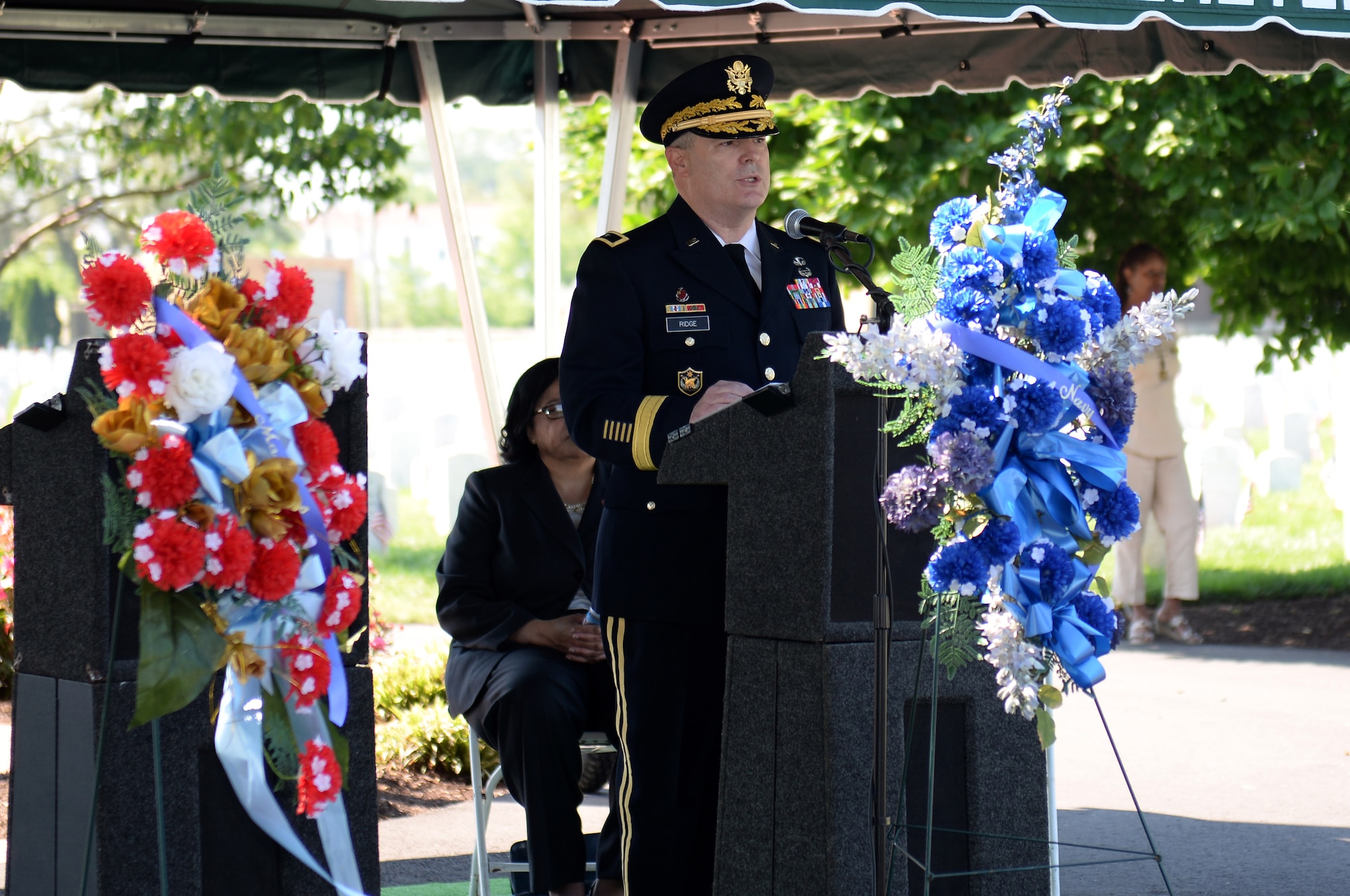U.S. Army Maj. Gen. Ross Ridge, Initial Military Training Center, Training and Doctrine Command deputy commanding general, speaks during a Memorial Day ceremony in Hampton, Va., May 26, 2014. Ridge spoke about the importance of living up to the example fallen Service members have set. (U.S. Air Force photo by Senior Airman Teresa J.C. Aber/Released)