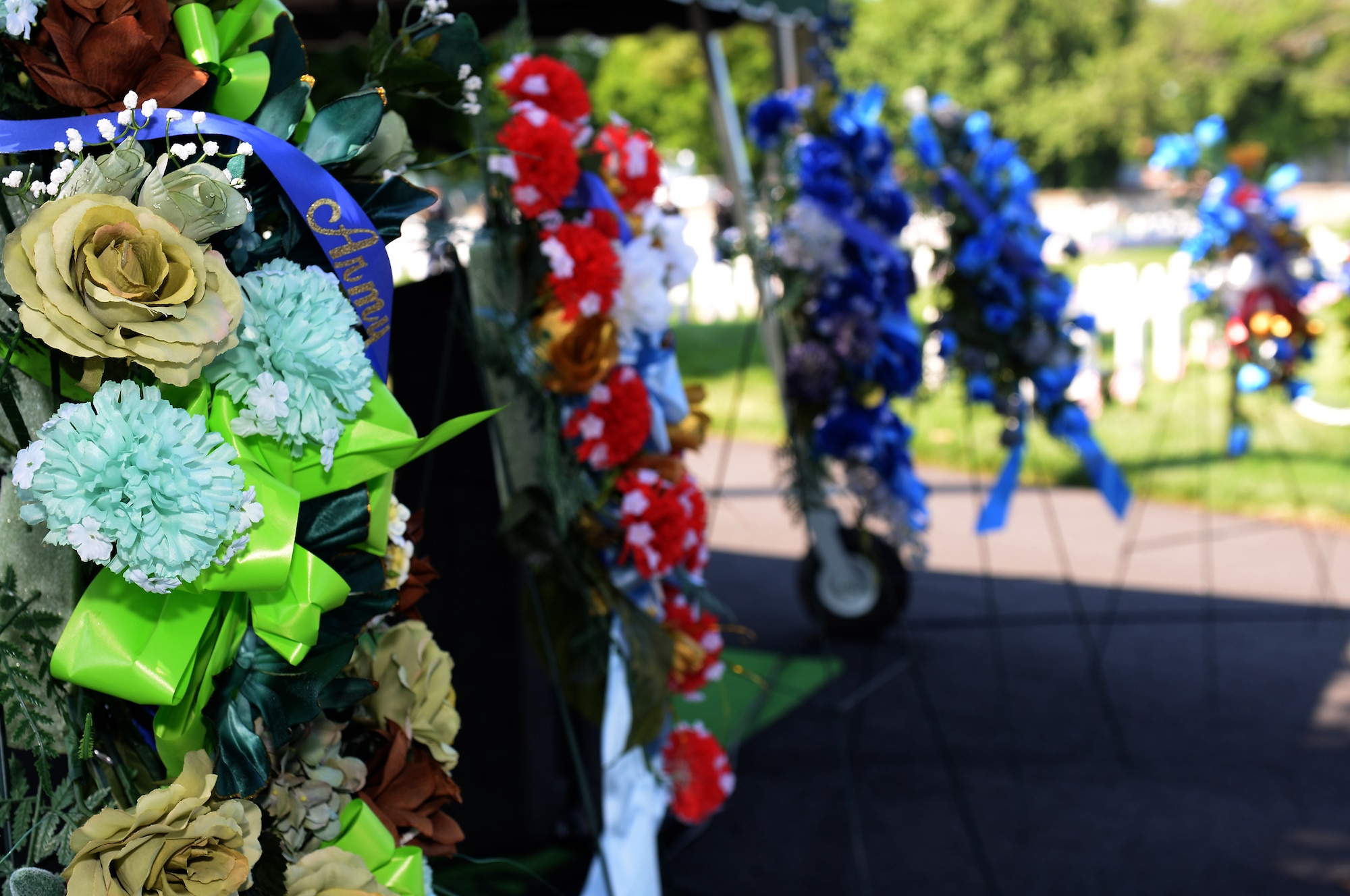 U.S. military members honored fallen veterans during a Memorial Day ceremony at the Hampton National Cemetery in Hampton, Va., May 26, 2014.  The observance, celebrated on the last Monday in May, grew from Decoration Day, a tradition which began to honor those U.S. Service members who died during the Civil War. (U.S. Air Force photo by Senior Airman Teresa J.C. Aber/Released)
