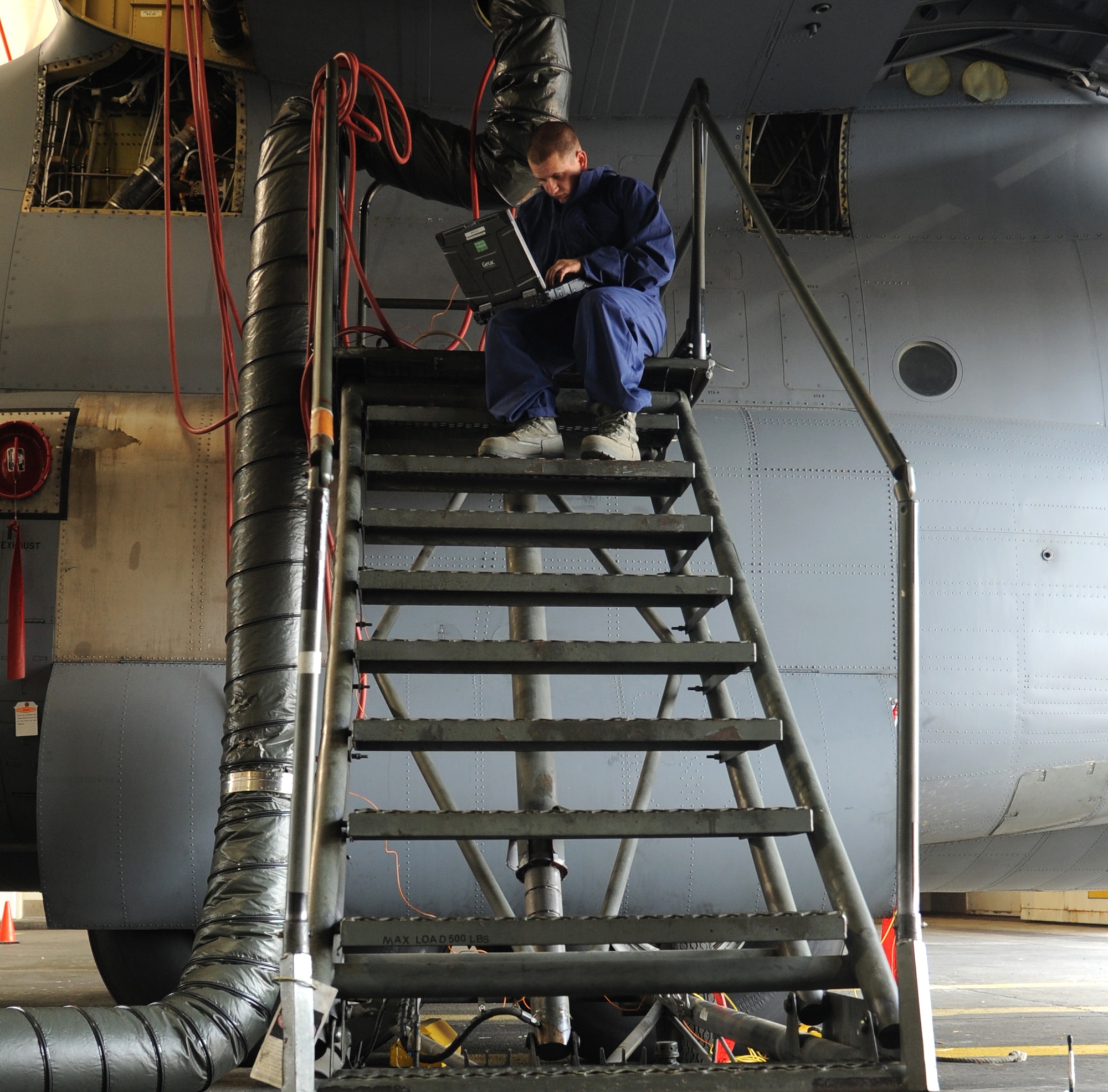 Senior Airman Richard Gates, a 19th Maintenance Group fuels system repair technician, uses a laptop to diagnose possible malfunctions May 27, 2014, at Little Rock Air Force Base, Ark. The 19th MXG fuels system repair flight works on fuel, water cell tanks, bladder cells and external tanks. (U.S. Air Force photo by Airman 1st Class Harry Brexel)