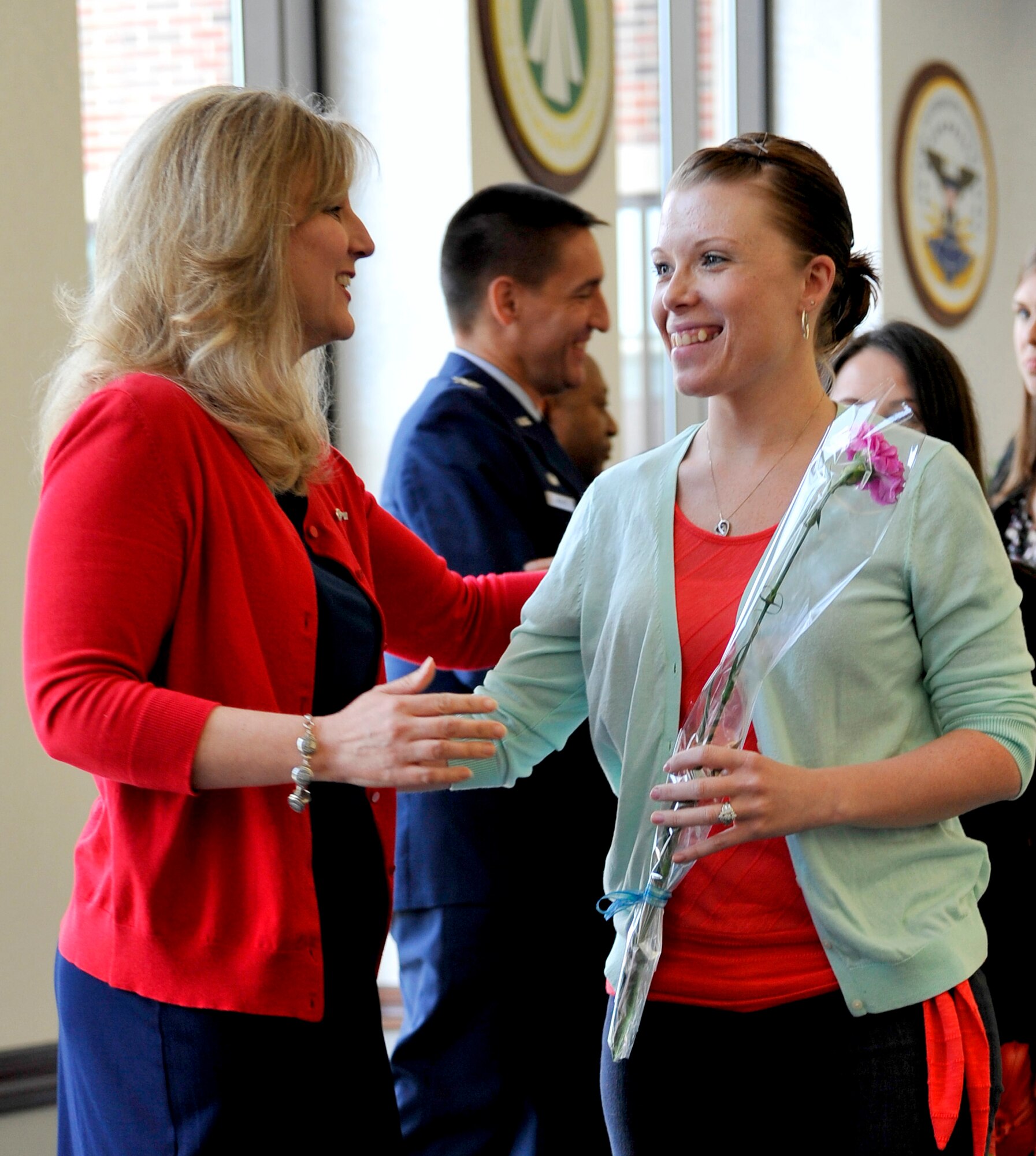 Each spouse received a flower during the Key Spouse luncheon May 21 at Scott. The flowers represented appreciation for Key Spouses by their units and Team Scott. Key Spouses are volunteers who help support military families. (U.S. Air Force photo/Airman 1st Class Kiana Brothers)
