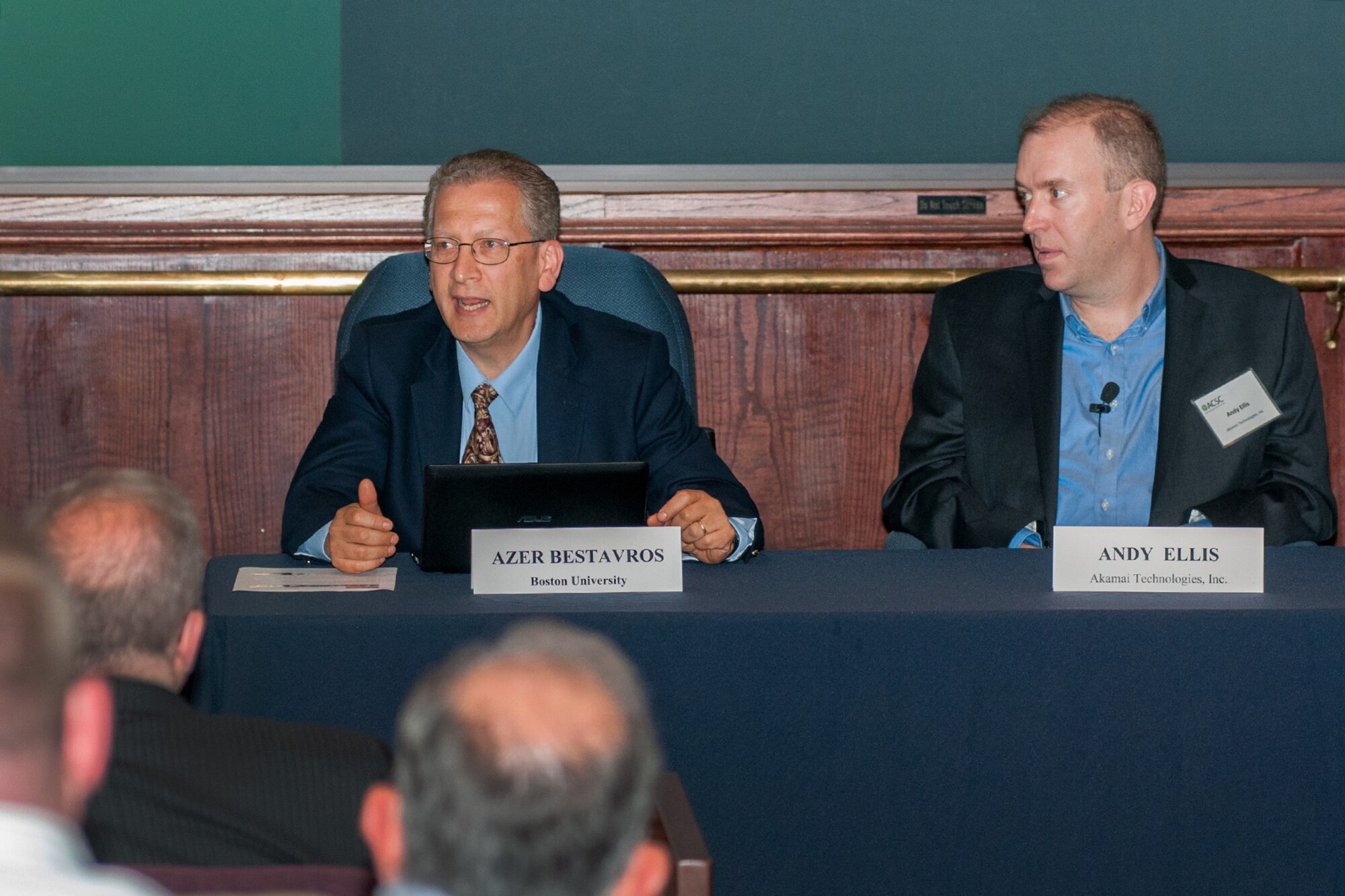 HANSCOM AIR FORCE BASE, Mass. -- Azer Bestavros (left), Ph.D., professor of computer science and director of the Hariri Institute at Boston University, and Andy Ellis, chief security officer at Akamai Technologies Inc., discuss cloud computing issues during a cyber exchange forum held here May 28. Ian Kelly, Google's Public Sector technical security lead, also participated in the panel. The forum, sponsored by the Advanced Cyber Security Center, featured a number of other leading industry, academic and government information technology leaders, including Dr. Tim Rudolph, chief architect and technology officer for the Air Force Life Cycle Management Center, and Keven Stamey, director of Engineering and Technical Management at Hanscom. (U.S. Air Force Photo by Rick Berry)