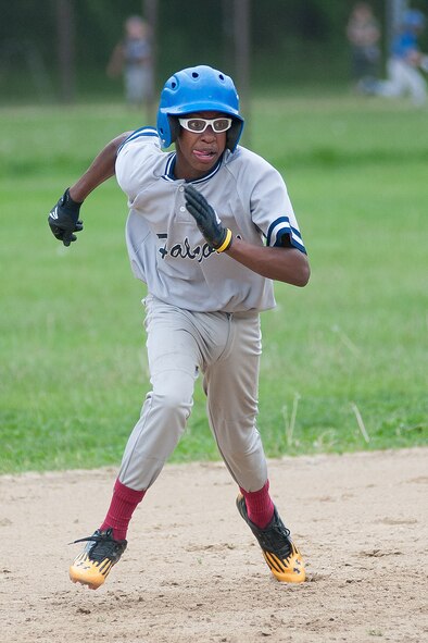 HANSCOM AIR FORCE BASE, Mass. -- Tavian Burress , a member of the Hansom Middle School Falcons boy’s baseball team, rounds second base during the team’s final home game of the season against Lexington Clarke Middle School May 27. The Falcons lost the game 14-7 to drop to 1-8 on the season. The team’s one win, the first in three years, came against Lincoln May 15. (U.S. Air Force photo by Mark Herlihy)