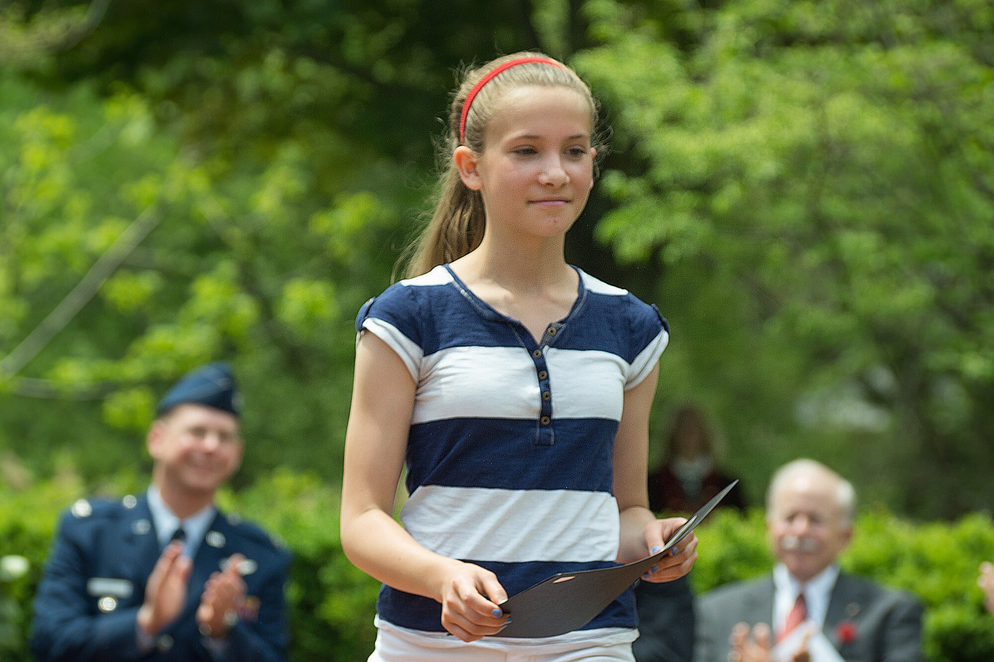 BEDFORD, Mass. – Elisabeth Seguin, a Hanscom Middle School seventh grader, is recognized for placing second in the Bedford Memorial Day Essay contest during a Memorial Day ceremony here, May 26. Seguin participated in the town’s Memorial Day ceremony that was held at Veterans Memorial Park. (Courtesy photo) 