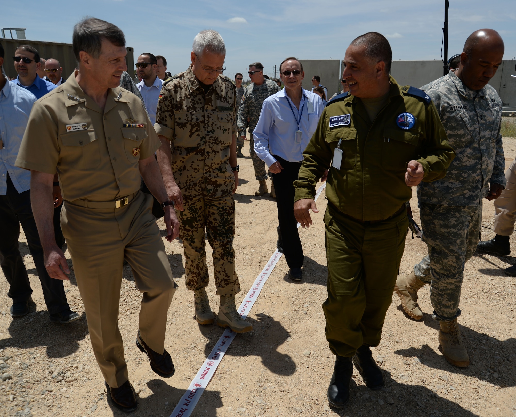 U.S. Navy Adm. Bruce W. Clingan, commander of U.S. Naval Forces Europe, left, listens as Israeli Defense Force Brig. Gen. Shachar Shohat, Air Defense Forces commander, leads a delegation on a tour of Hatzor Air Base, Israel, May 19, 2014. The admiral toured the installation to oversee the progress of Juniper Cobra 14, a bilateral defense exercise. (U.S. Air Force photo illustration by Staff Sgt. Joe W. McFadden/Released)