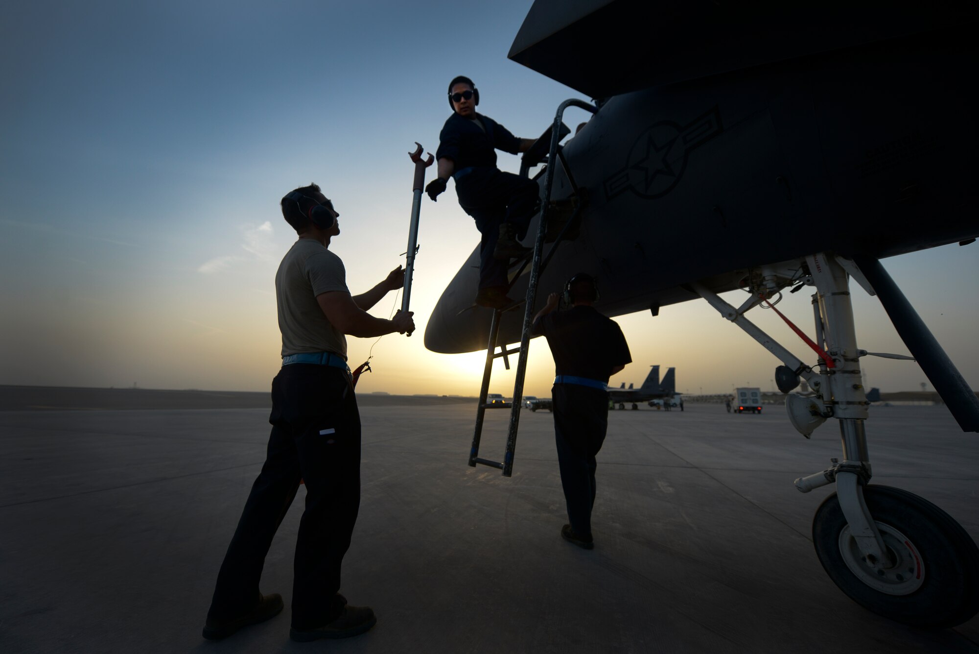 Aircraft maintainers from the 380th Expeditionary Aircraft Maintenance Squadron install a canopy strut in an F-15E Strike Eagle May 26, 2014, at an undisclosed location in Southwest Asia. The canopy strut prevents the aircraft canopy from closing once hydraulic pressure is removed. (U.S. Air Force photo byTech. Sgt. Russ Scalf/Released)