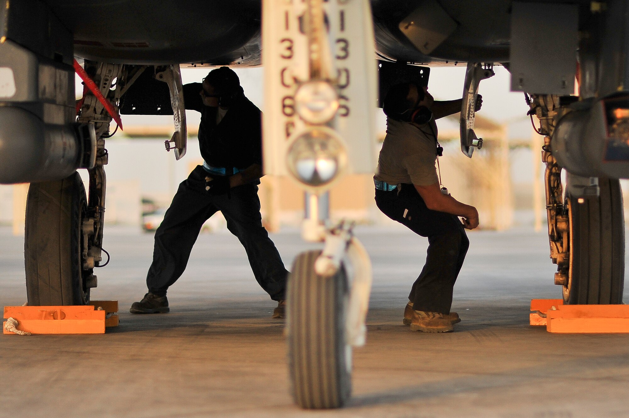 Crew chiefs from the 380th Expeditionary Aircraft Maintenance Squadron perform a post-flight inspection on an F-15E Strike Eagle May 26, 2014, at an undisclosed location in Southwest Asia. Post-flight inspections ensure that aircraft are serviceable and ready for the next day’s flight. (U.S. Air Force photo byTech. Sgt. Russ Scalf/Released)
