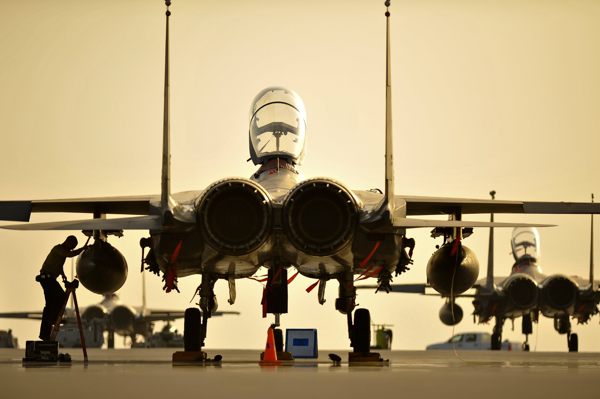 Staff Sgt. Adam Cloy, 380th Expeditionary Aircraft Maintenance Squadron, repairs a left wing pylon on an F-15E Strike Eagle after a fuel transfer malfunction May 26, 2014, at an undisclosed location in Southwest Asia. The pylons transfer fuel from external tanks to the internal fuel cells. (U.S. Air Force photo byTech. Sgt. Russ Scalf/Released)