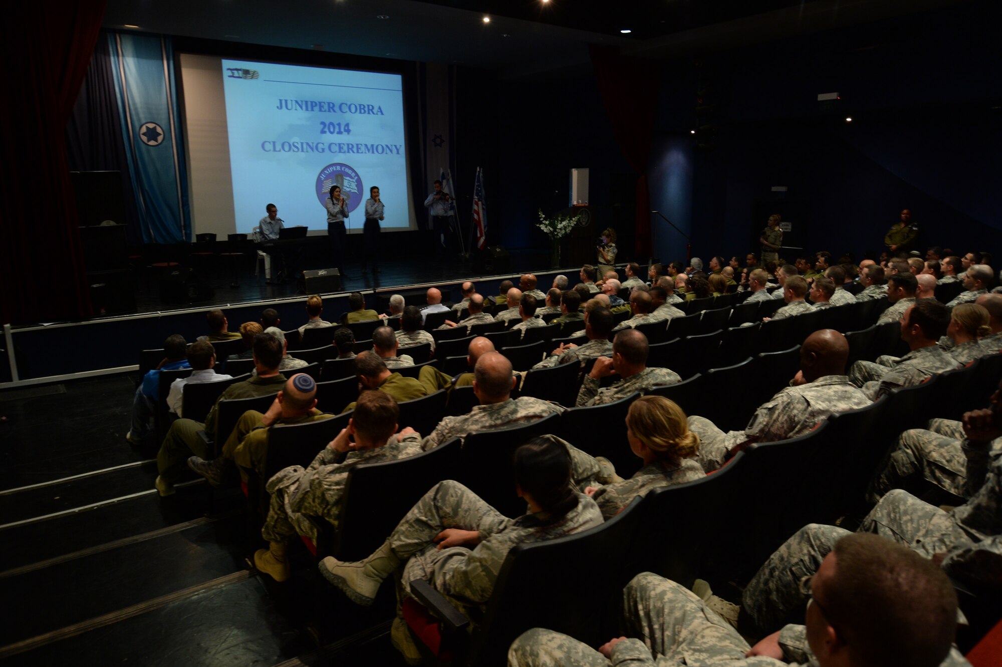 Members of the Israel Air Force Band sing during the closing ceremony of the bilateral Juniper Cobra 14 defense exercise at Hatzor Air Base, Israel, May 22, 2014. Both nations’ militaries agreed a computer-simulated exercise would be the most cost-effective and efficient way to conduct JC14. (U.S. Air Force photo by Staff Sgt. Joe W. McFadden/Released)