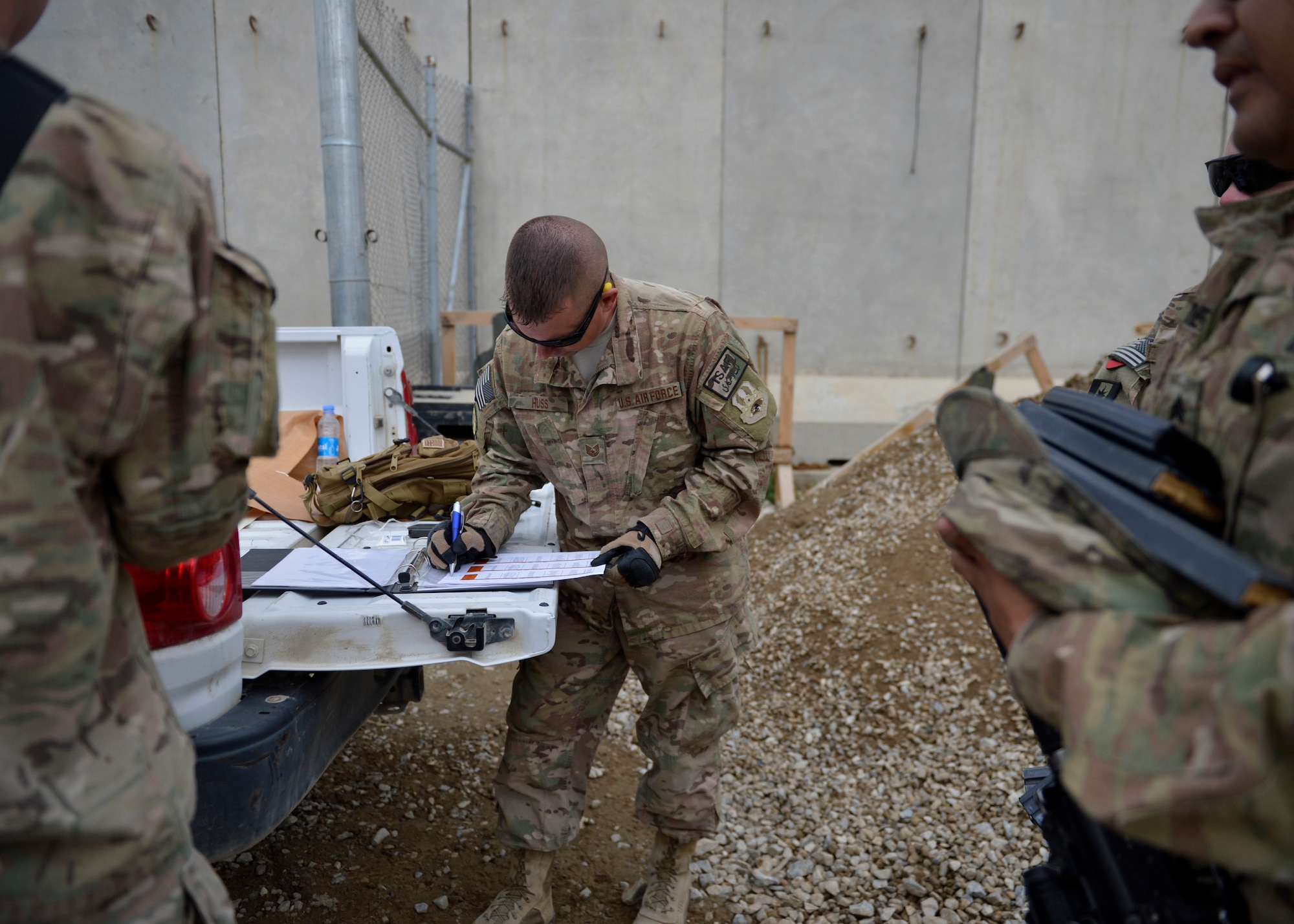 Tech. Sgt.Benjamin Huss, 455th Base Defense Squadron combat arms instructor, reviews a range qualification list May 17, 2014 at Bagram Airfield, Afghanistan.  As a CATM instructor, Huss is in charge of fixing weapons, inspecting weapon inventory and small arms training for Airmen who travel outside the Airfield.  Huss is deployed from Langley Air Force Base, Va. and a native of Fremont, Ohio. (U.S. Air Force photo by Staff Sgt. Evelyn Chavez/Released)