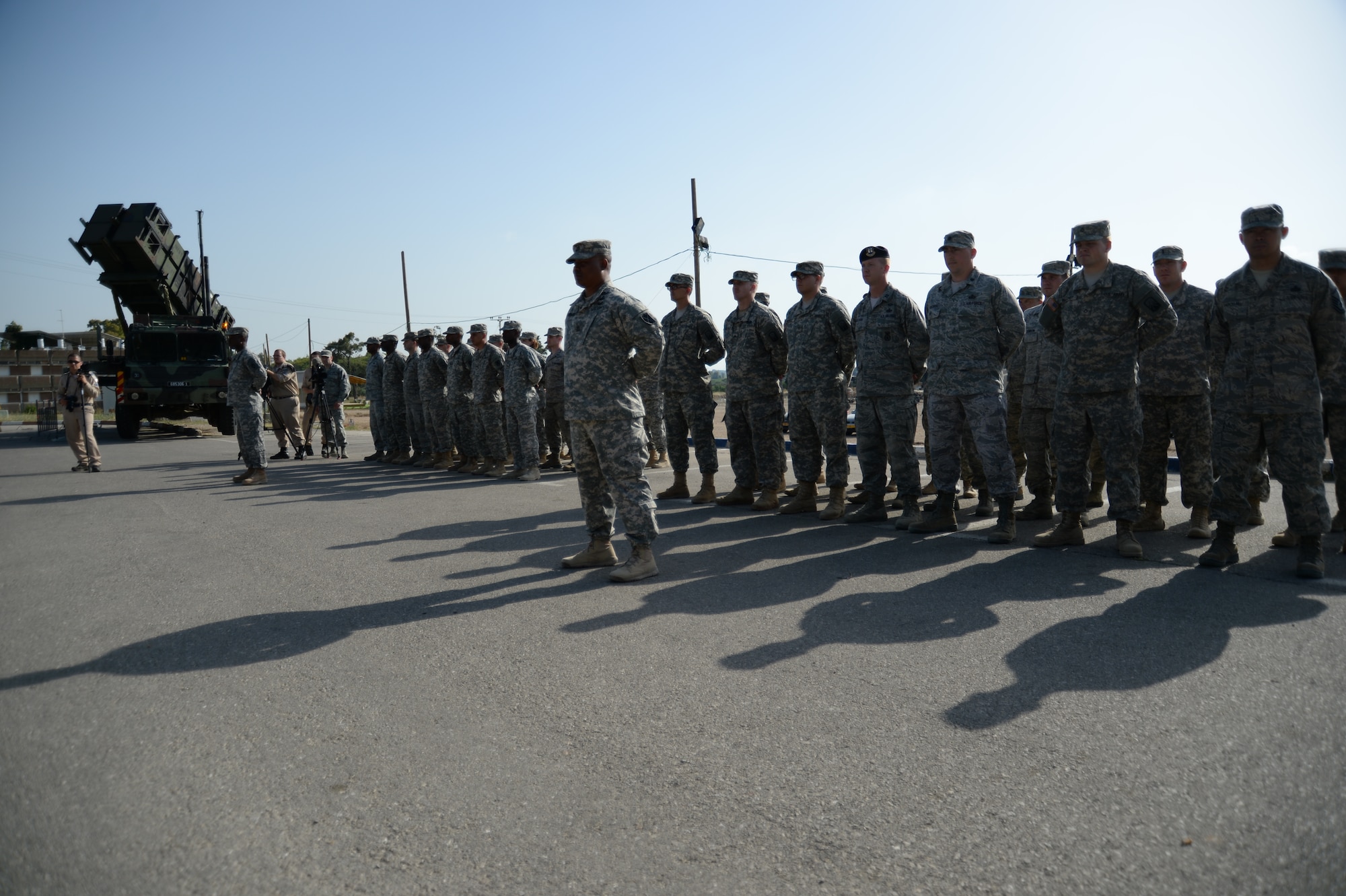U.S. service members stand in formation prior to the start of the closing ceremonies of the Juniper Cobra 14 bilateral exercise at Hatzor Air Base, Israel, May 22, 2014. JC14 is an exercise designed to train combined U.S. and Israeli military forces to respond as a combined force to a regional crisis. (U.S. Air Force photo by Staff Sgt. Joe W. McFadden/Released)