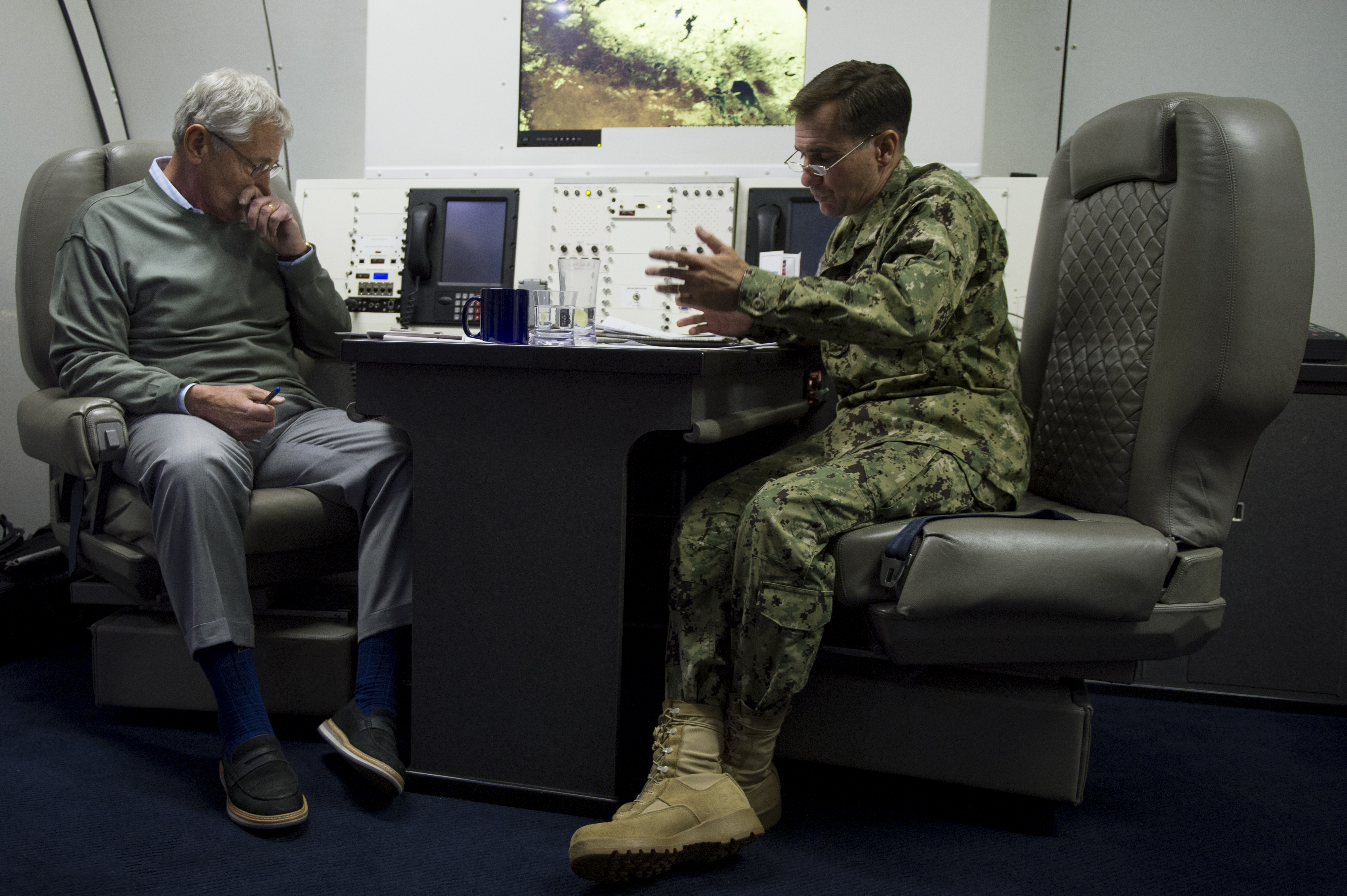 Defense Secretary Chuck Hagel left prepares for a press briefing with Pentagon Press Secretary Navy Rear