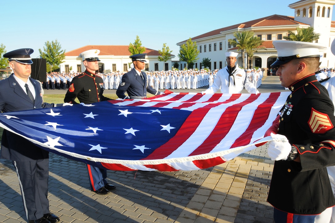 U.S. service members unfurl the 15-star flag during a flag-raising ceremony on Naval Station Rota in Rota, Spain, July, 4 2012. Naval Station Rota raises the U.S. flag only one day of the year due to limitations set in the Agreement for Defense Cooperation between the United States and the Kingdom of Spain.  
