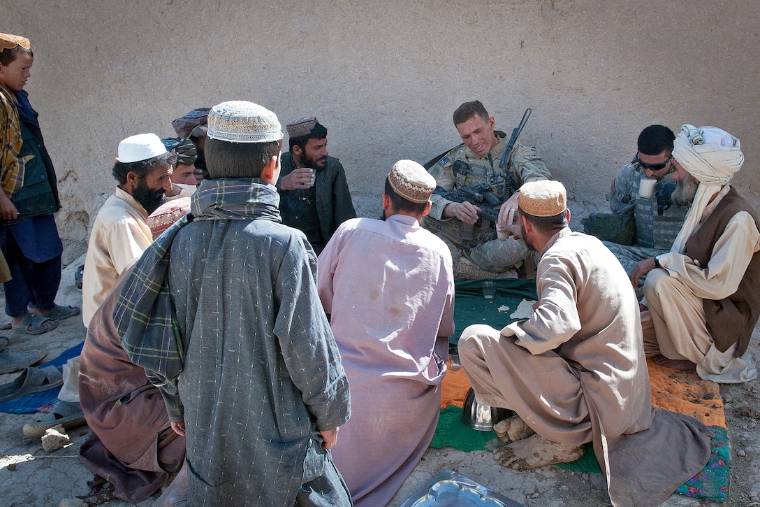U.S. Army 1st Lt. Frederick Reier meets with villagers of Hutake in northern Afghanistan's Nawah province, June 14, 2012. Reier, a platoon leader, is assigned to the 82nd Airborne Division's 1st Battalion, 504th Parachute Infantry Regiment, 1st Brigade Combat Team.  
