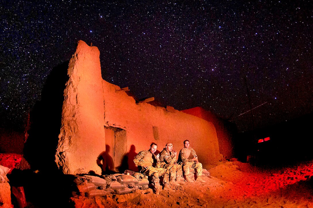 U.S. Army Maj. Jason Glemser and U.S. Lt. Cols. Rob Salome and Daniel Mouton take a break under the stars on Joint Security Station Hasan in the Gilan district in southern Afghanistan's Ghazni province, June 11, 2012. Glemser, Salome and Mouton are assigned to the 82nd Airborne Division's 1st Brigade Combat Team.  

