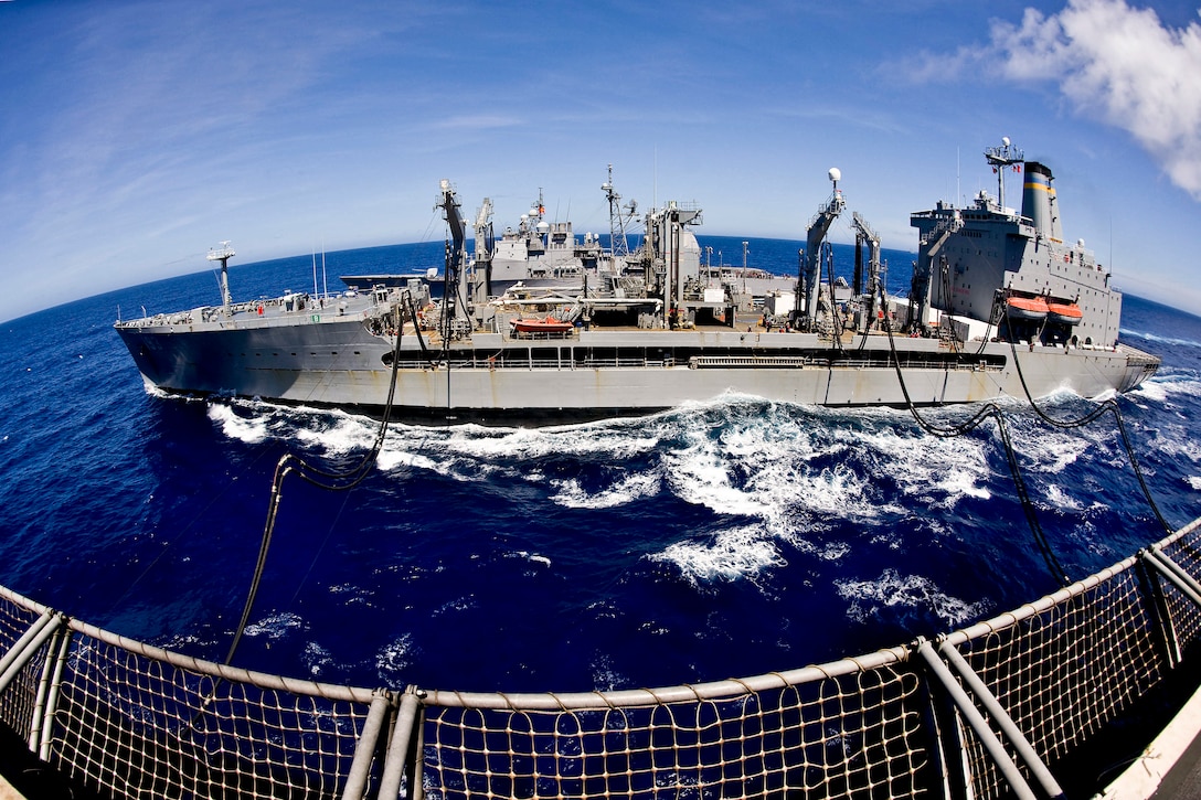 The Military Sealift Command's Fleet Replenishment Oiler USNS Walter S. Diehl sails next to the aircraft carrier USS George Washington during a refueling at sea in the Pacific Ocean, June 15, 2012. The George Washington and embarked Carrier Air Wing 5 provide a combat-ready force to protect and defend the collective maritime interest of the U.S. and its allies.  
