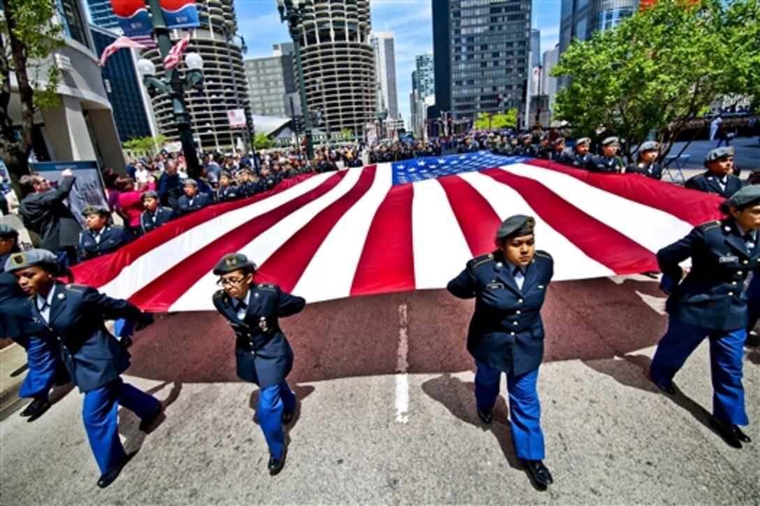 Junior ROTC cadets from one of the Chicago public schools carry a large U.S. flag during Chicago’s Memorial Day Parade, May 24, 2014. 