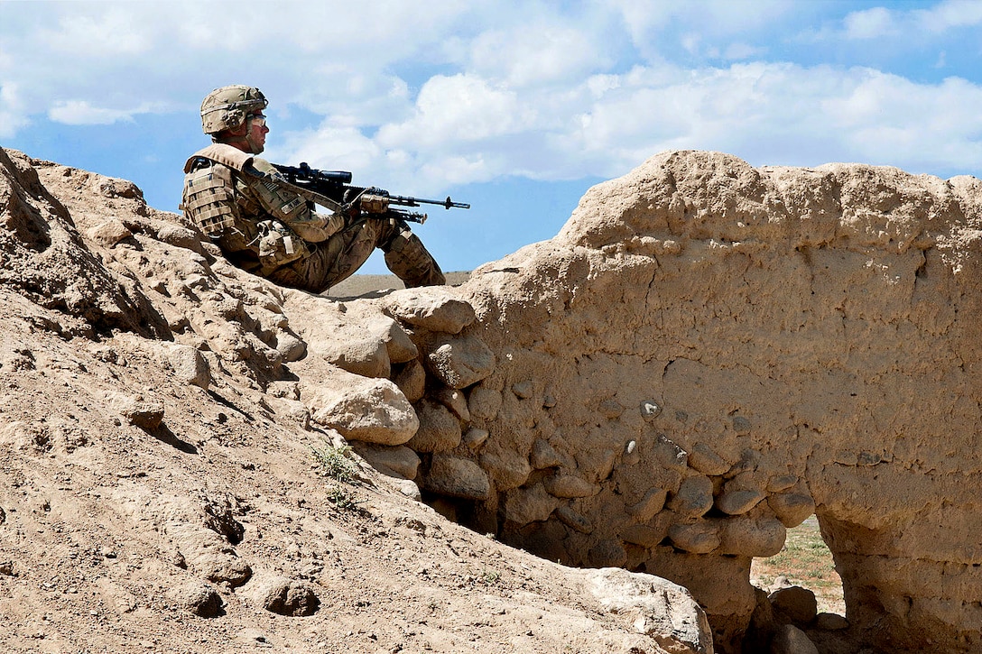 A U.S. paratrooper armed with an M-14 battle rifle pulls security during combat operations in Afghanistan's Ghazni province, June 4, 2012.U.S.  
