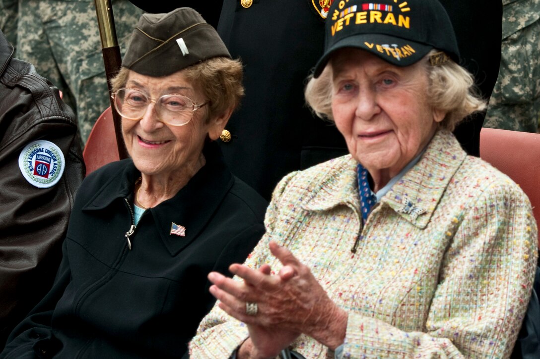 Ellen Levitsky Orkin, 92, left, and Dorothy Levitsky-Sinner, 95, sisters who served as nurses during World War II, attend a plaque dedication ceremony in their honor in Bolleville, France, June 4, 2012. Bolleville officials made the sisters honorary citizens for their work at a local hospital during the war. "We were just doing what we were told to do - our jobs," said Orkin, a former Army 1st lieutenant. Her sister was an Army 2nd lieutenant.  

