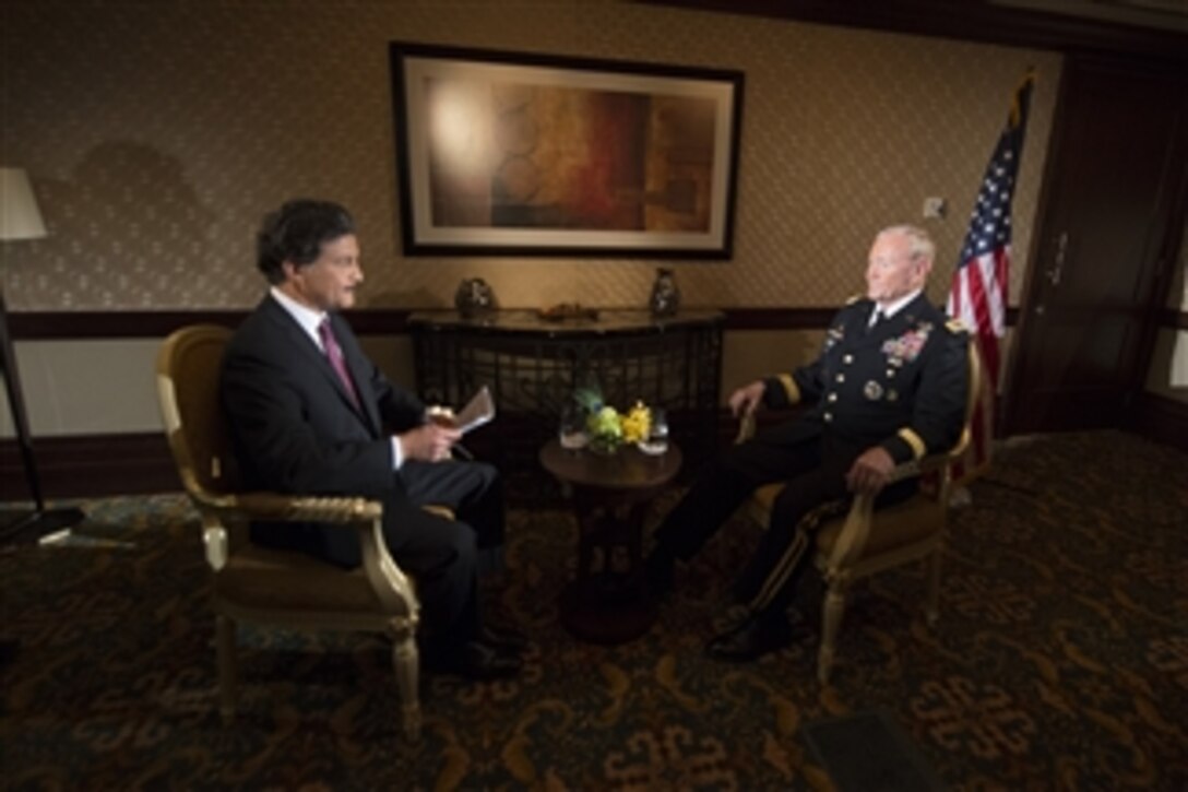 U.S. Army Gen. Martin E. Dempsey, chairman of the Joint Chiefs of Staff, answers questions during an interview by Sky News Arabia reporter Mohannad Al Khatib in Abu Dhabi, United Arab Emirates, May 28, 2014.