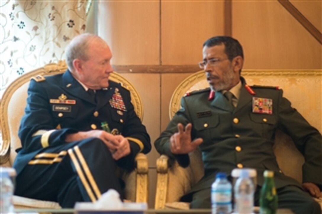 U.S. Army Gen. Martin E. Dempsey, left, chairman of the Joint Chiefs of Staff, meets with Army Lt. Gen. Hamad Thani al-Rumaithi, chief of staff of United Arab Emirates’ armed forces, in Abu Dhabi, United Arab Emirates, May 28, 2014. 