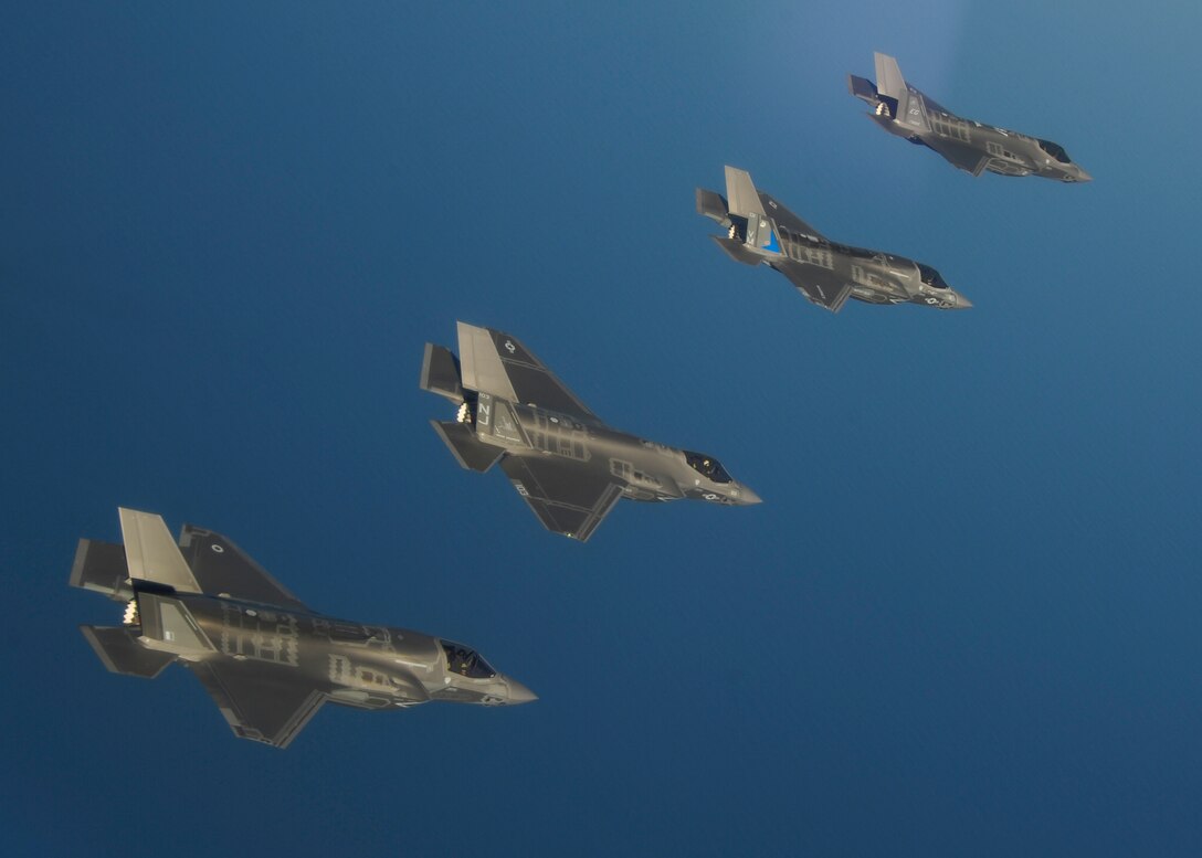 A United Kingdom F-35B Lightning II flies alongside a Navy F-35C, a Marine Corps F-35B, and an Air Force F-35A from the 33rd Fighter Wing in the skies above Eglin Air Force Base, Fla. May 21. The F-35s at Eglin AFB surpassed 5,000 combined training sorties May 28, contributing more than a third of all sorties in the Department of Defense program. The 33rd FW F-35 Integrated Training Center trains F-35 A/B/C Lightning II pilots, maintainers, air battle managers and intelligence personnel for the Marine Corps, the Navy, the Air Force and, in the future, at least eight international partners. (U.S. Air Force photo/Staff Sgt. Katerina Slivinske)