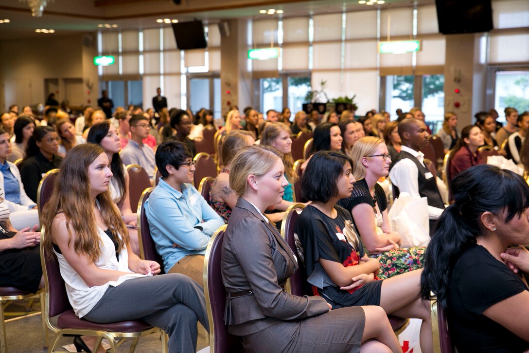 Audience members listen to a leadership panel May 15 at The Palms on Camp Hansen. The audience participated in the 2014 Military Women’s Leadership Symposium, where women were encouraged to speak their minds freely on issues that affect them as females in the military. (U.S. Marine Photo by Cpl. Natalie M. Rostran/Released)