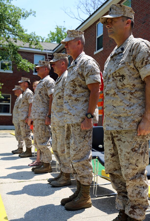 Distinguished guests with 2nd Marine Division stand at attention during the citation reading at a Bronze Star Medal ceremony held at the 2nd Battalion, 2nd Marine Regiment, 2nd Marine Division, headquarters aboard Marine Corps Base Camp Lejeune, N.C., May 28, 2014. The Bronze Star Medal with combat distinguishing device was awarded to 1st Lt. Grant Todd, a platoon commander with Fox Co., 2nd Bn., 2nd Marines, for his actions, heroism, courage and leadership while serving in Afghanistan in support of Operation Enduring Freedom.

