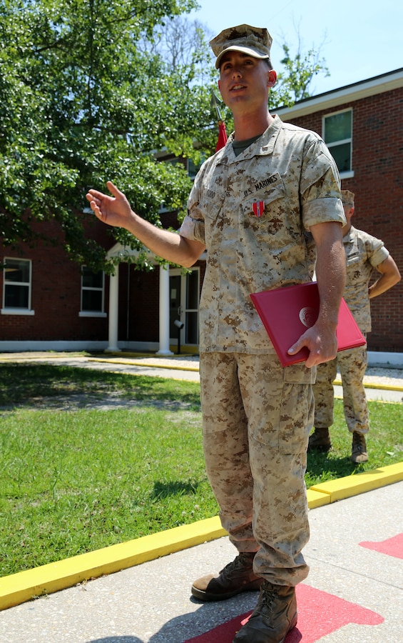 First Lt. Grant Todd, a platoon commander with Fox Company, 2nd Battalion, 2nd Marine Regiment, 2nd Marine Division, speaks to Marines with the company after receiving a Bronze Star Medal with combat distinguishing device during a ceremony held at the battalion headquarters aboard Marine Corps Base Camp Lejeune, N.C., May 28, 2014. The Bronze Star Medal is awarded for acts of heroism, acts of merit or meritorious service in a combat zone. Acts of heroism are rewarded with a combat distinguishing device.